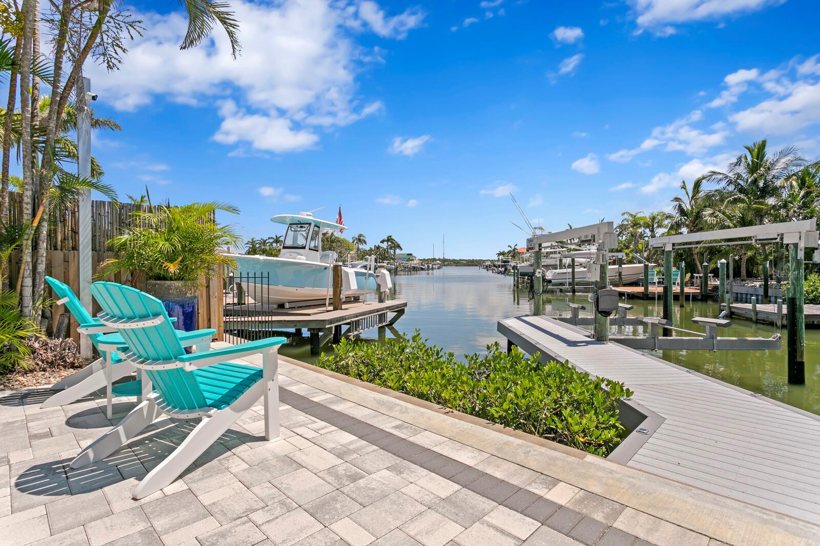 BOATER’S PARADISE IN REDINGTON SHORES | 16,000 LB LIFT + NO FIXED BRIDGES
If you’re looking for the perfect home for your boat, this is it. Tucked away on a wide canal with direct access to the Intracoastal—and no fixed bridges to the Gulf—this Redington Shores residence is a rare opportunity for serious boaters seeking both function and style. A 2023 composite dock with a 16,000 lb boat lift sets the tone for the ultimate waterfront lifestyle, ready to accommodate your large vessel with ease—whether for weekend cruising, fishing adventures, or daily sunset runs.
This meticulously upgraded home features a main roof replaced in 2023, a flat roof added in 2024, and newer soffit and fascia for long-lasting protection. Inside, you'll find beautiful wide plank porcelain tile flooring throughout (2023), all new stainless steel appliances, a tankless water heater (2023), and a new washer and dryer.
The interiors showcase a fresh coastal design with vaulted ceilings, skylights, and an open layout that fills the home with natural light. Quartz countertops, soft neutral tones, and thoughtfully selected fixtures create a clean, breezy atmosphere that perfectly complements the waterfront setting. Every detail—from the cabinetry to the lighting—reflects a refined yet relaxed coastal aesthetic.
Outside, the interlock paver system runs from the front walkway and both sides of the driveway to the backyard, where an artificial turf area adds privacy and charm. The property also includes a concrete seawall, sprinkler system, and three new exterior doors.
A security camera system surrounds the home for added peace of mind, and the one-car garage offers additional storage for your gear.
Located in the charming seaside community of Redington Shores, this home is just two blocks from the sugar sand beach—a quick walk, bike ride, or golf cart cruise away. Nearby, you’ll find local shops, dining, and coastal parks, making it easy to enjoy the best of Florida’s waterfront living.
No HOA. No compromises. Just a stylish, modern waterfront home designed with the boater in mind—ready for your vessel and your next chapter on the water.