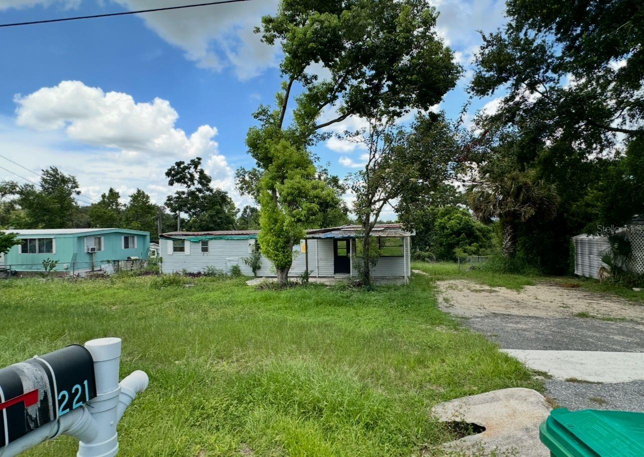 Investor Special! Located just off US-441 and only 5 minutes from The Villages, this 2-bedroom, 1-bathroom manufactured home sits on its own land in the Skyline Hills community of Lady Lake.
The home offers 925 sq ft of living area plus additional covered spaces including porch and utility areas for a total of over 1,100 sq ft under roof. Built in 1973, it is in need of repairs and updates, making it the perfect fix & flip, rental investment, or personal project at a low entry cost.
This property sits on a 10,000 sq ft lot (approx. 0.23 acres) and has a land value alone of $36,000 (2025 assessed total value: $62,181). It is being sold as-is for only $60,000. No lot rent. Public utilities available. Close to major shopping, medical centers, restaurants, and highways.
Cash or renovation loans only. Don’t miss this opportunity to invest in a high-demand area with strong potential growth.