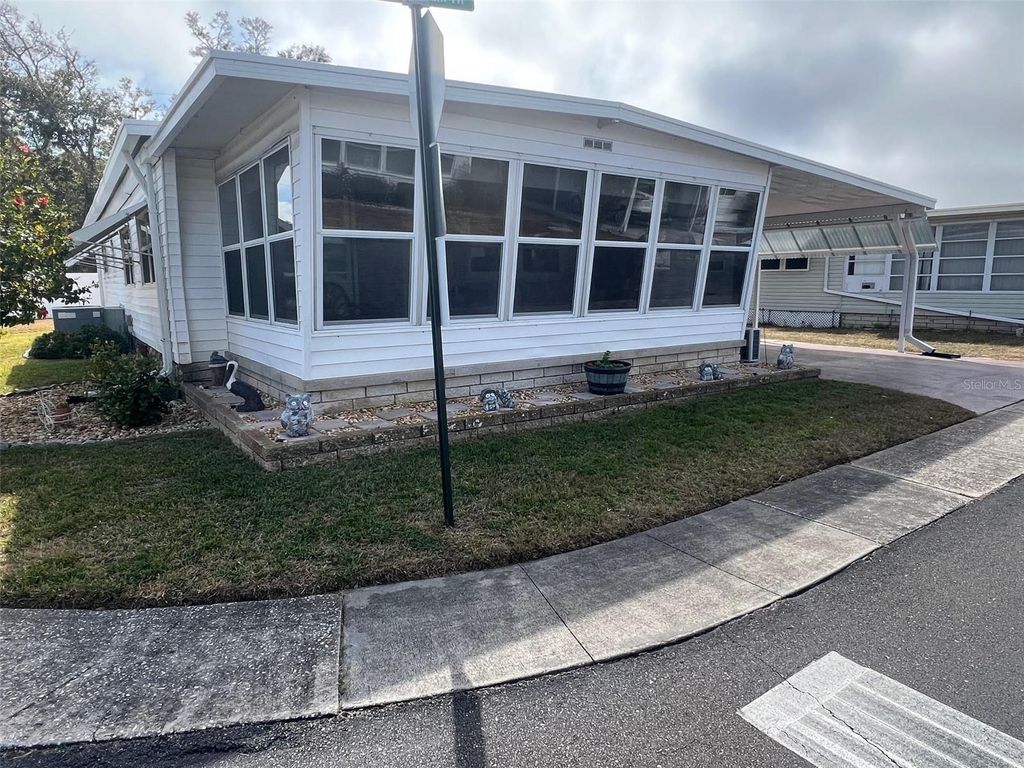 Photo of 148 Pindo Palm Street W, Largo, FL 33770 (MLS # TB8476422)