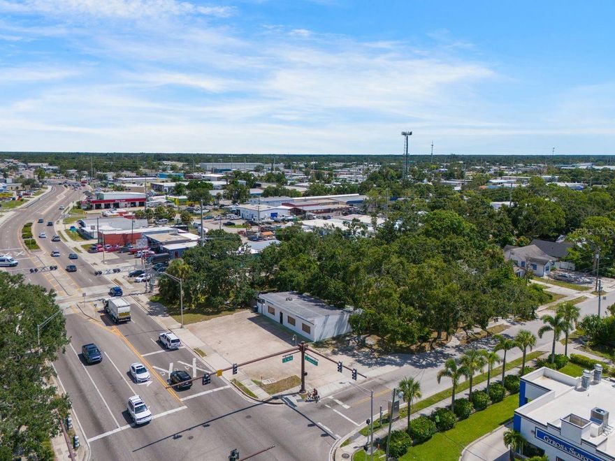 This 0.66-acre corner parcel is positioned at the highly visible, signalized intersection of US 301 (Washington Boulevard) and 10th Street, offering unmatched access, visibility, and versatility for forward-thinking developers. The property package includes a strategically located office building with a spacious driveway and dual ingress/egress onto both Washington Boulevard and 10th Street, as well as an income-producing residential unit that provides immediate cash flow while future development plans take shape.
With its DTE zoning, the site is primed for modern mixed-use development, encouraging residential, office, retail, or live/work concepts. A recent site plan proposed for the property envisioned a four-story mixed-use building featuring 36 residential units and approximately 7,700 square feet of office space, showcasing the strong development potential within this zoning framework.
The location provides exceptional traffic exposure and connectivity, situated directly on US 301 with quick access to Fruitville Road (SR 780), Downtown Sarasota, and Interstate 75. Just minutes from the city’s cultural venues, waterfront, and thriving restaurant scene, the property also benefits from strong walkability and bikeability, appealing to residents and professionals seeking an urban lifestyle.