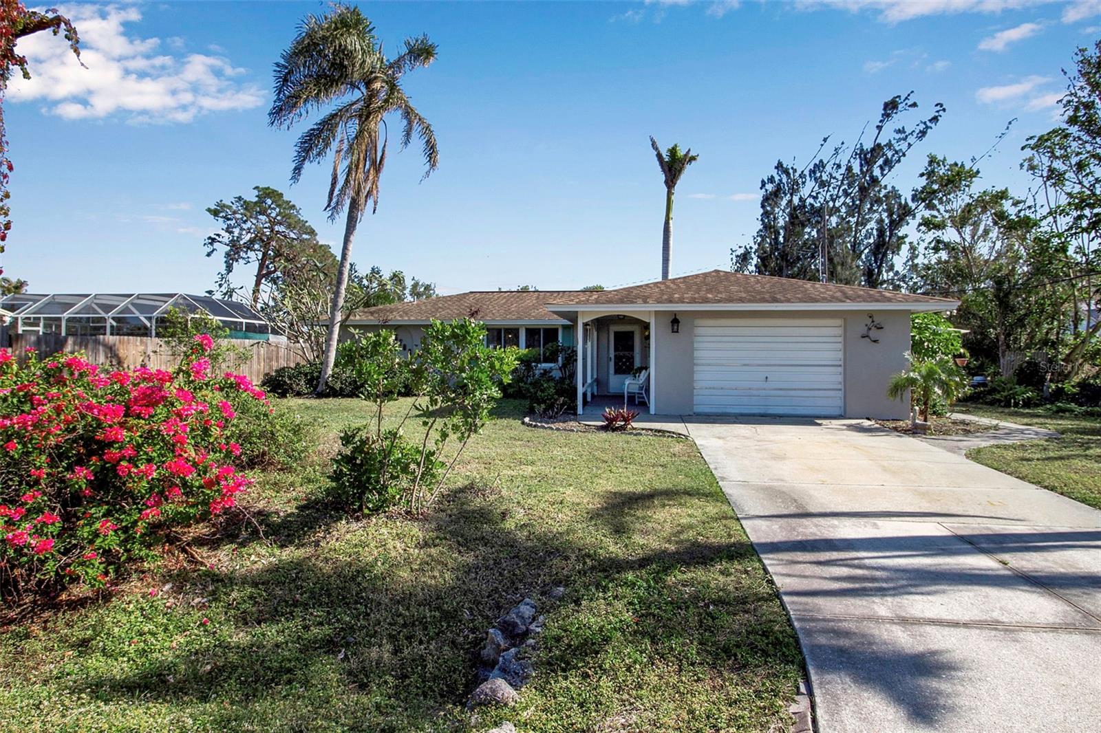 Welcome to 5708 Miami Road, a beautifully corner-lot home located in a peaceful neighborhood in South Venice, Florida. This inviting 2-bedroom, 2-bathroom residence offers comfortable living in an ideal location — just minutes from downtown Venice, the beach, and all the conveniences the area has.
As you step inside, you’ll immediately notice the spacious open-concept layout filled with natural light, creating a warm and welcoming atmosphere. The living room features large windows, providing a bright and airy space for relaxation or entertaining guests. The adjacent dining area flows seamlessly into the galley-way kitchen.
The home’s standout feature is the Florida room, a versatile space that can be enjoyed year-round. Whether you're looking to relax with a book, enjoy your morning coffee, or entertain guests, this Florida room offers a peaceful retreat with views of the lush gorgeous garden view. Outside of the Florida room is a concrete area for you BBQ, set up an outside seating area or fire pit. The mature garden wraps around the home. FLOOD ZONE X
HOME UPDATES include: AC unit, Water Heater, the house has been Re-piped, IMPACT WINDOWS, Electrical updated, kinetico water system. Additional updates found attached to the MLS.