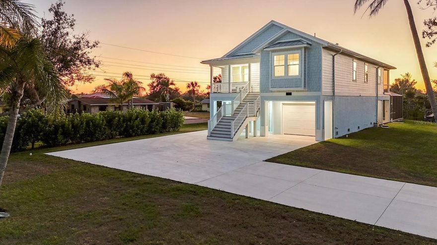 One or more photo(s) has been virtually staged. This brand-new coastal cottage construction is a true gem, offering the perfect blend of luxury, comfort, and waterfront living. Situated on over 1.2 acres of saltwater Rocky Creek Canal frontage, this Florida Cottage is ideal for those who want to enjoy the best of coastal living. Just 3 miles from the beach by car or a scenic boat ride away, you'll be able to experience the natural beauty of Florida every day. The home features 3 spacious bedrooms and 2 bathrooms, with soaring 10-foot ceilings and 14.5ft to the peak of the cathedral. The attention to detail is evident in every corner, from the impact windows and doors to the energy-efficient spray foam insulation. The structure boasts a concrete stemware foundation, Hardi siding on the second floor, with Hardi Soffits and Azek trim, offering both durability and style. The tongue-and-groove porch ceilings on the upper level and the 5V metal roof add a charming touch to the exterior. Property is in Englewood Gardens Subdivision offering membership if available to the Englewood Gardens Beach Club Inside, you'll find engineered hardwood floors on the second floor and elegant ceramic tile on the ower level. The kitchen is a dream, with a large 9-foot island, custom cabinetry, and a powerful custom hood vent—perfect for cooking and entertaining. The open layout flows seamlessly, making it ideal for both relaxing and hosting gatherings. The luxurious primary bedroom offers a peaceful retreat, with a reading nook bench that overlooks your expansive acreage. The ensuite bathroom is equally impressive, featuring a walk- in shower, freestanding soaking tub, walk-in closet, and his-and-her sinks with LED mirrors for extra lighting and modern appeal. The outdoor living space is just as spectacular, with a large pool area and expansive patio—perfect for lounging and enjoying the Florida sunshine. It’s alsoplumbed for an outdoor kitchen, should you decide to add one. Walk down the composite dock, where you can fish, relax, or simply take in thestunning views. With the western-facing rear exposure, you’ll have the pleasure of watching breathtaking Florida sunsets every evening. This home truly offers the best in Florida living, with all the modern conveniences, natural beauty, and a serene setting. Whether you're looking for a peaceful retreat or a place to entertain, or room for a large detached garage, or RV Parking this property has everything you need. Don't missyour chance to own this exceptional waterfront home!