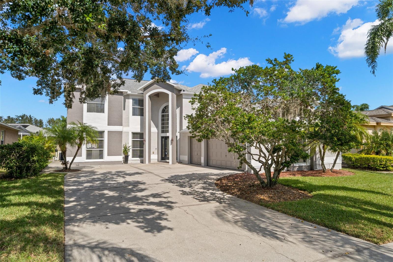 One or more photo(s) has been virtually staged. Welcome to this stunning 5-bedroom, 3,294 sq ft home located in the desirable Worthington subdivision of the gated East Lake Woodlands Golf Course community. This residence offers the perfect combination of luxury, comfort, and functionality, with high-end finishes, thoughtful updates, and a resort-style outdoor oasis designed for year-round Florida living. As you arrive, you’ll be greeted by a grand 18-foot entryway accented by a Swarovski chandelier and soaring ceilings that create a bright and elegant first impression. Inside, the home’s open-concept floor plan offers both formal and casual living areas, including a formal living and dining room, a spacious family room, and a beautifully remodeled kitchen that is truly the heart of the home. The kitchen features Bosch appliances (including a 2023 refrigerator), a marble backsplash, 42” cabinetry with crown molding, pull-outs, a lazy Susan, buffet counter, wine storage, and a breakfast bar. A downstairs guest bedroom with half bath adds convenience and flexibility for visitors or multi-generational living. Throughout the home, you’ll appreciate the stylish flooring—no carpet—for a sleek look and easy maintenance. Upstairs, retreat to your expansive primary suite, complete with dual walk-in closets, a sitting area with speaker wiring, and a fully remodeled marble en suite bathroom featuring a soaking tub, step-in shower, dual-sink vanity, and private water closet. Three additional upstairs bedrooms are generously sized and offer excellent storage space, making this home ideal for families or those who love to host. Step outside to your own private paradise. The solar-heated pool and spa feature Baja shelves, waterfalls, and a newer screen enclosure (2023). The outdoor kitchen and covered entertaining space make this the perfect spot for alfresco dining, evening gatherings, or simply relaxing while enjoying the lush landscaping that provides both privacy and tranquility. Additional upgrades include smart home security and thermostats, a newer A/C (2023), water heater (2024), and a 2017 roof for peace of mind. The oversized side-entry 3-car garage offers storage, yard access, and plenty of room for vehicles, hobbies, or additional organization. Living in East Lake Woodlands means access to a premier lifestyle, with optional memberships available for golf, tennis, pool, and clubhouse amenities. The community is also conveniently located near top-rated schools, shopping, dining, and beautiful nature trails, all while being a short drive to Tampa, St. Petersburg, and award-winning Gulf Coast beaches. This turn-key home is fully remodeled, energy-efficient, and move-in ready, offering everything today’s buyers are searching for with no costly updates required. Don’t miss the opportunity to call this remarkable property your new home—schedule your private showing today and experience the best of Florida living in East Lake Woodlands!