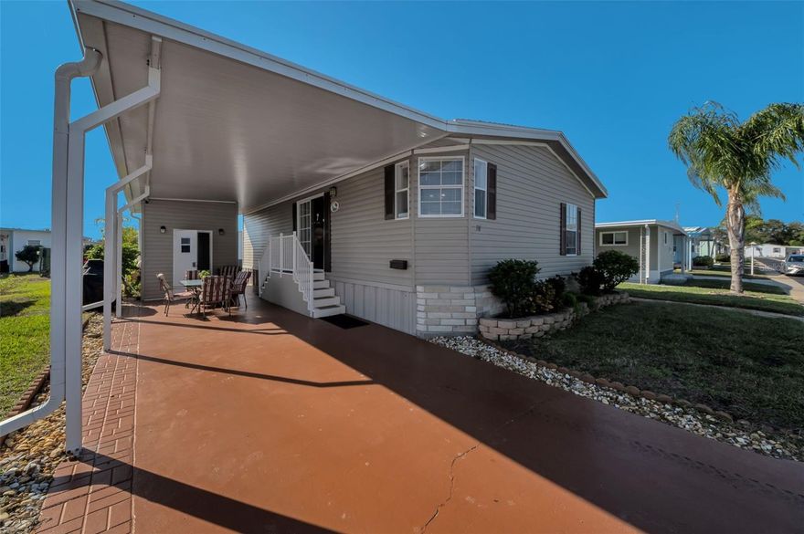 Discover a rare opportunity in the highly desirable Tarpon Shores 55+ Resident-Owned Community—NO LAND LEASE! You own the land, and the $40,000 co-op share is included in the list price and can even be financed through the HOA. Better than New! Built in 2005 and move-in ready, this immaculate home offers a bright, open-concept layout and comes fully furnished with a fully equipped kitchen—plus a KitchenAid grill. Beautifully landscaped and thoughtfully designed, the property features an oversized 2-car carport, an 8x12 storage shed, a peaceful open patio, and plenty of space for outdoor gatherings. Inside, the kitchen and dining area flow seamlessly into a cozy living room, with an indoor laundry closet and included washer and dryer. The spacious primary bedroom features an en suite bath with a step-in shower and generous closet space, while the updated hall bath includes a tub/shower combination and a new toilet—both toilets have been replaced. A new roof (2023) adds tremendous value. This home features durable, factory-finished vinyl-over-gypsum wall panels...not wall-paper. They offer a clean, modern look that’s easy to maintain and simple to personalize with paint if desired. Whether you’re enjoying natural breezes from the shaded porch or relaxing in the Florida sunshine on the patio, this home offers effortless comfort and a welcoming atmosphere. Tarpon Shores is known for its friendly community spirit, active social calendar, and outstanding amenities—including a large clubhouse, heated pool, pickleball, bocce, shuffleboard, billiards, library, BBQ area, and monthly newsletters. The affordable $315 monthly fee includes lawn care and spraying, water, sewer, trash, cable TV, and internet. With low taxes and an unbeatable location near the World-Famous Tarpon Springs Sponge Docks, beaches, parks, dining, shopping, boating, and golf, this exceptionally maintained property delivers an easy, low-maintenance Florida lifestyle in one of the area’s most sought-after resident-owned communities.