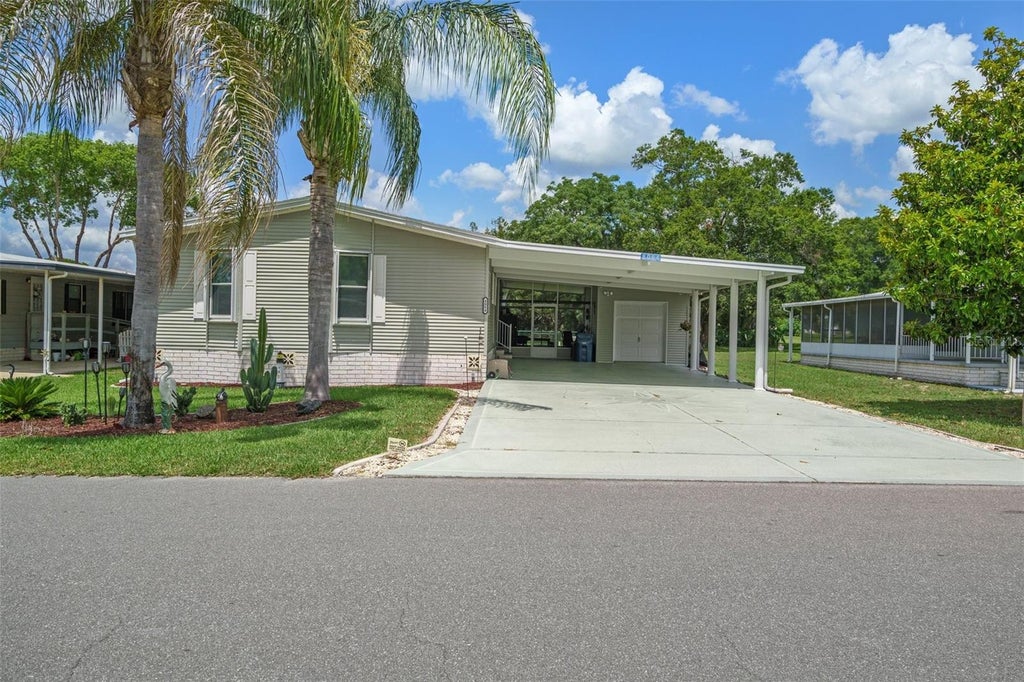 Photo of 8084 Little Tee Lane, Brooksville, FL 34613 (MLS # TB8543165)