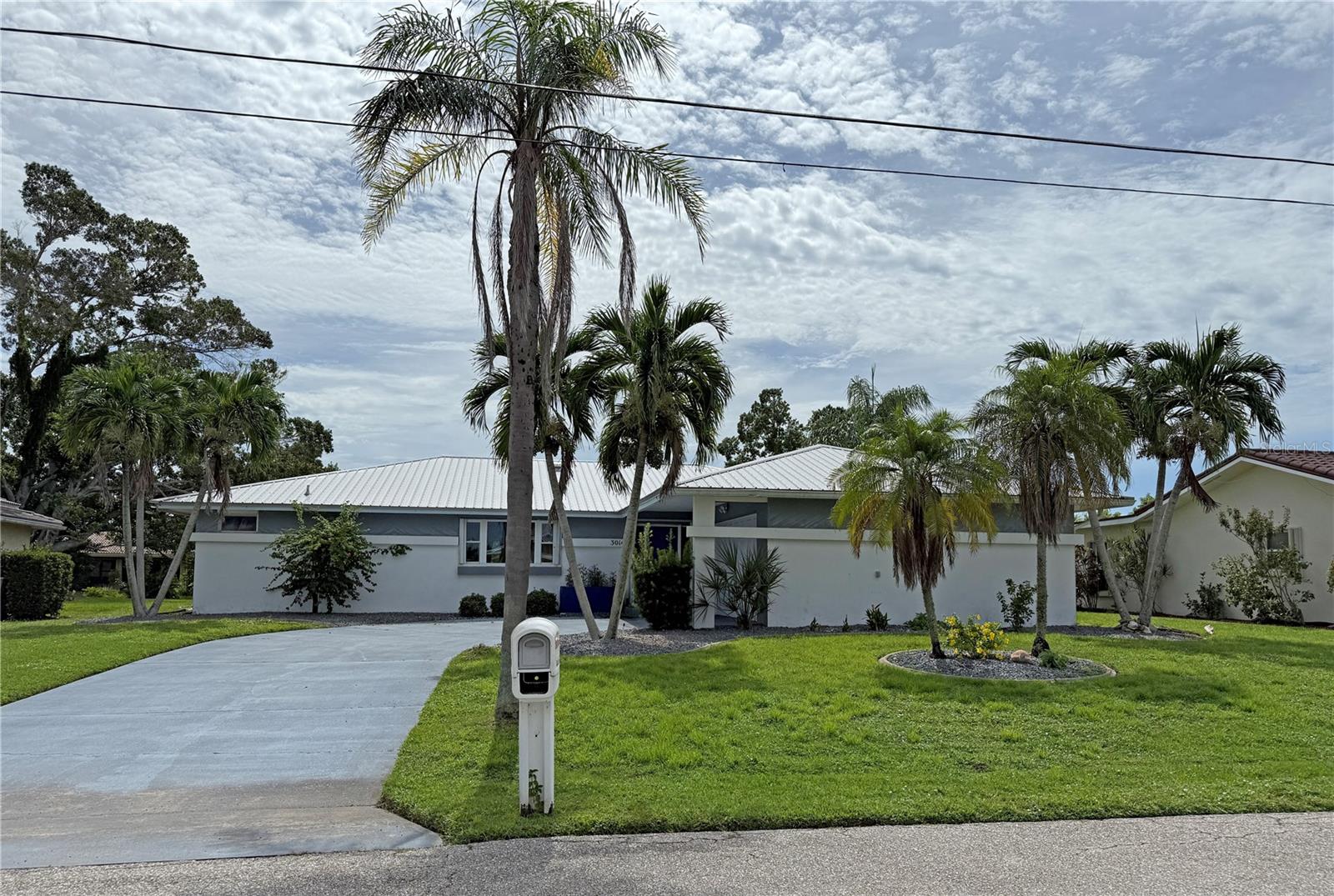 Spacious POOL HOME located in the desirable deed restricted community of Punta Gorda Isles. This light and bright home offers an opena and split bedroom floor plan with 3 Bedrooms, 2 Bathrooms, attached 2 Car Garage,Great Room, Family Room with wet bar, Kitchen, Inside Laundry and screened Lanai. The Master bedroom suite has a private bathroom with dual sinks and walk in shower. Both bathrooms were professionally remodeledThere are two generous sized guest bedrooms and the guest bathroom has a walk in shower. The Inside Laundry has stacked full size washer and dryer and a laundry sink. The garage has an opener, side door entry, attic access. Your living space extends to the screened Lanai with large heated inground pool, plenty of deck for sunbathing and large covered area with two ceiling fans. The view is greenbelt. Other features include rain gutters, accordion hurricane shutters, NEW METAL ROOF 2022......NEW A/C 2020...NEW CARPET THROUGHOUT AND ON THE LANAI. Utilities are city water and sewer. This home is in a quiet neighborhood minutes from historic downtown Punta Gorda shopping, dining, medical care, waterfront parks, walking and biking paths, art galleries, Fishermen's Village, Charlotte Harbor Event Center, weekend farmer and artisan markets, boat ramps, fishing piers, weekend events and more!