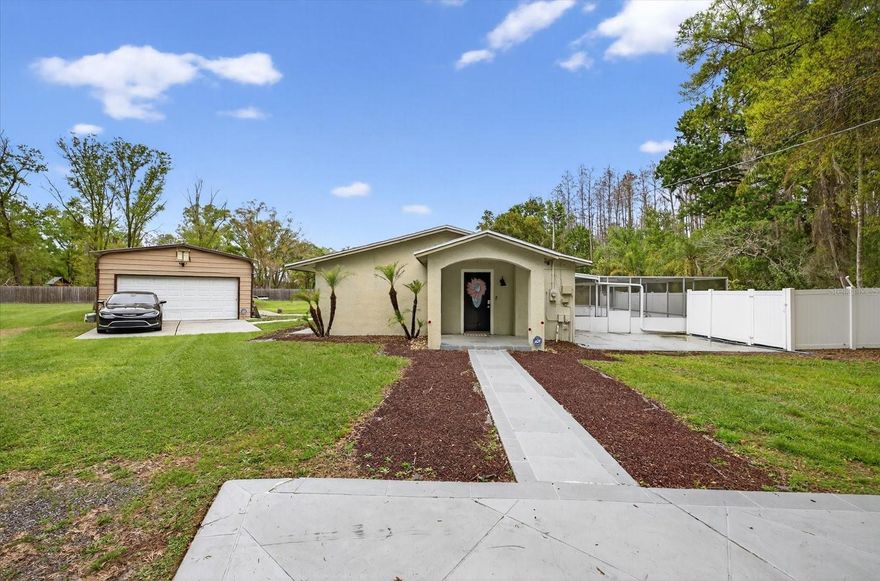 Exceptional opportunity to own a versatile 4-bedroom, 2-bath ranch-style property situated on 2.26 acres with ASC-1 commercial zoning, offering endless possibilities for residential living, a home-based business, or future investment. The home has been thoughtfully updated and features a bright, welcoming interior with new flooring, fresh interior paint, crown molding, trim details, and recessed lighting throughout. The kitchen has been refreshed with new countertops, backsplash, sink, and refinished cabinetry, creating a functional and stylish space for everyday living.

 Step outside and enjoy the private screened-in inground pool, perfect for relaxing or entertaining, along with a charming garden area that adds character and outdoor enjoyment to the property.

The expansive lot also includes a detached workshop/storage building, providing additional space for projects, equipment, or business needs. With ASC-1 zoning, the property offers flexibility and was previously operated as a licensed daycare, making it an ideal option for entrepreneurs or anyone seeking a live/work setup. Conveniently located with excellent accessibility, this unique property offers space, functionality, and incredible potential. Schedule your private showing today.