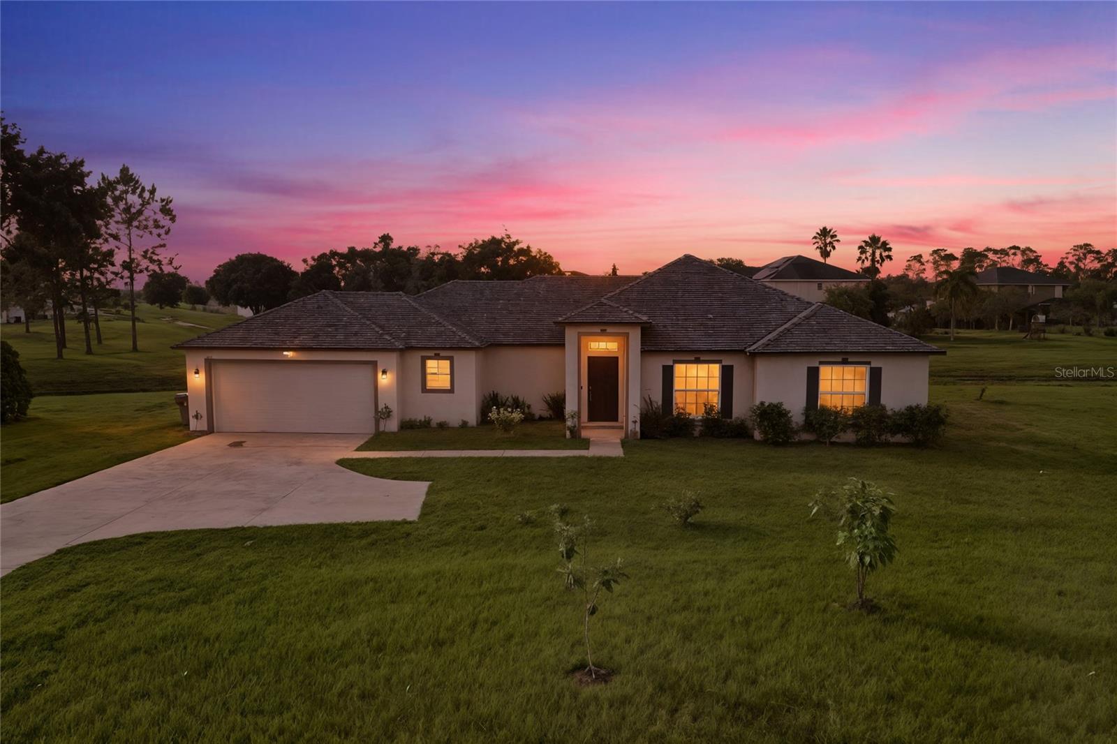 Welcome to 224 Genoa Court, a beautifully maintained and nearly new single-family home offering 4 bedrooms, 2 bathrooms, and 1,787 square feet of thoughtfully designed living space, all nestled on an oversized 0.37-acre premium lot with no rear neighbors in the desirable community of Poinciana Village. Built in 2023, this home showcases an open-concept floor plan with vaulted ceilings that create a bright, airy atmosphere perfect for entertaining or everyday living. The luxury tile flooring flows seamlessly throughout. No carpet adding to its modern, low-maintenance appeal. The heart of the home is the stunning kitchen, featuring granite countertops, custom cabinetry, a large island, and like-new stainless steel appliances, including a walk-in pantry for ample storage. Imagine sipping your morning coffee as sunlight pours across the gleaming counters or preparing a home-cooked meal while guests gather nearby. The spacious primary suite is your private retreat, complete with a beautifully designed en-suite bath where you can relax and unwind at the end of the day. Step outside to your expansive backyard oasis. Your canvas to create the outdoor entertainment area, garden, or play space of your dreams all while enjoying peaceful privacy and breathtaking Florida sunsets. The oversized driveway provides plenty of parking for guests, perfect for hosting family gatherings and holiday celebrations. Additional highlights include a washer and dryer, luxury tile throughout, and a premium lot with no rear neighbors. Conveniently located just 20 minutes from Old Town Kissimmee and under 30 minutes to Davenport, this home offers easy access to Orlando and Tampa. Nearby attractions include Lake Marion Creek Wildlife Management Area with scenic trails, Vance Harmon Park with sports facilities and walking paths, and local favorites like Melao Bakery, Don Julio’s Mexican Restaurant, and Poinciana Chinese Restaurant. With HCA Florida Poinciana Hospital, top-rated schools, shopping, and parks nearby, you’ll enjoy the perfect blend of suburban tranquility and urban accessibility. 224 Genoa Court isn’t just a home. It’s a lifestyle, where comfort, style, and community come together. Schedule your private tour today and step into the Florida living experience you’ve been dreaming of.