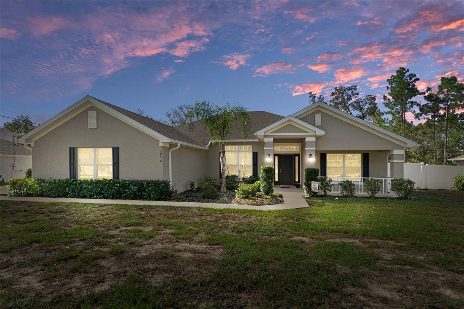Your dream home awaits! This stunning 4-bedroom, 3-bath residence with a separate flex room/office sits on a lush, fenced half-acre. The welcoming front porch invites you to relax and soak in the surrounding nature. Step into your private backyard oasis—complete with a sparkling heated saltwater pool, waterfall feature, and soothing massage jets in the sitting area. Inside, soaring vaulted ceilings, designer finishes, and a luxurious master retreat with tray ceilings and walk-in closets create the perfect blend of comfort and style. The home also features stainless steel appliances, a formal dining room, and a sunny eat-in kitchen. Additional upgrades include a water filtration system, newer water pump, and generous space for both entertaining and everyday living. This home is truly move-in ready for the Florida lifestyle you’ve been dreaming of—schedule your showing today!