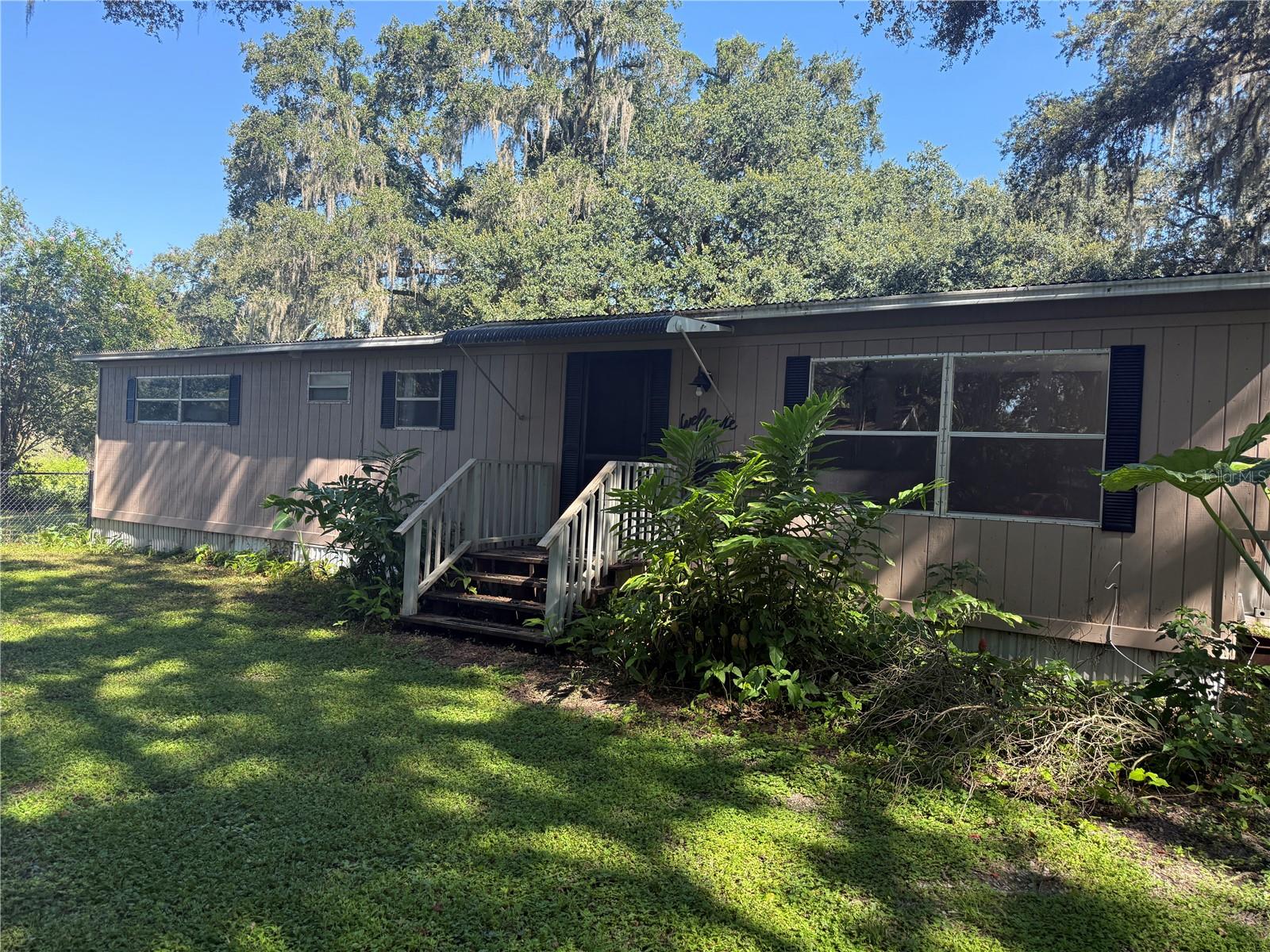 One of a kind unique opportunity for an income-producing investment or a communal living situation with Mother-in-law or other family members. A generational living situation would be perfect for this property. Former single-wide remodeled into a double-wide duplex type situation. Each side has its own entry. All work has been permitted and completed in a professional manner. This lovely home is sitting on 1.85 acres. There is a pond in the back behind the fence line. There is an area for a lovely garden that is fenced in. The home has a well and a septic. There is a screened-in porch area and a large grassy area on each side of the home for folks to enjoy. This home is private on a back road and does not have an HOA or deed restrictions (other than county laws). Plenty of room to park trucks, company vehicles, RVs or boats. Whether you are seeking a peaceful homestead or a home you can personalize as your own rental portfolio while residing in one side.