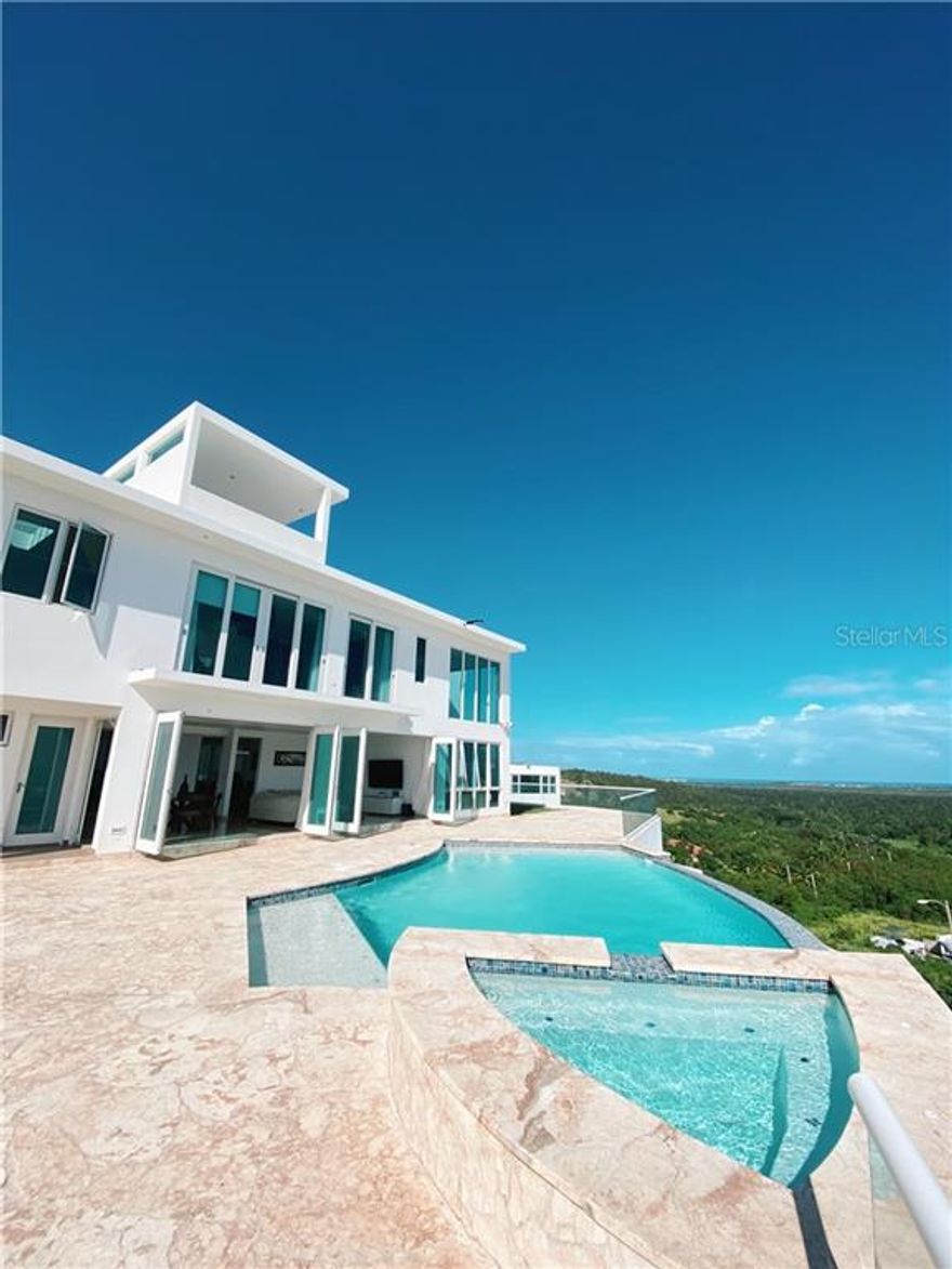 Enjoy Paradise! Unique property with panoramic views to the northeast of Puerto Rico. Spacious  and luminous, perfect to relax and bask into the warm sun and the fresh tropical air. With everything you search in a home, this heaven on earth won’t last long. Don’t let it go   
 It has 6 rooms, 7 complete baths, 2 half baths, 2 garages, 6,000p2 approximately, 2,598m2, infinity pool, jacuzzi, Gym, generator, cistern.