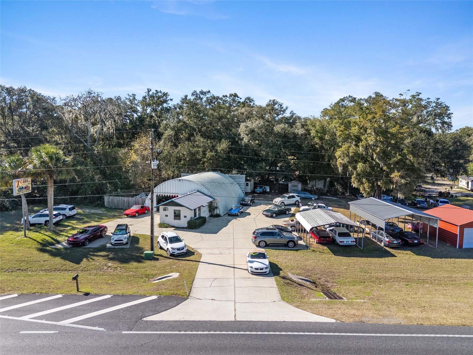 Import Automotive Repair Center and Used Car Dealership of 43 years. Z Cars Of Ocala has 575' of frontage with just over 1 acre of B-4 zoning on Hwy 441 in Ocala with a daily traffic count of 20,200. This property has everything needed to continue this well recognized business with it's established customer base. Land, building, business and lots of equipment included. There is lots of room for used cars to be displayed along Hwy 441 with 3 entrances and a custom pole sign. The 13' x 24' block office space comes set up with 2 office computers, printer, fiber modem, Wi-Fi, phone system, Stainless fridge, microwave & has 2 restrooms. The shop is a 40' x 43' metal Quonset building which includes: 3 Rotary car lifts; 7,000, 9,000 & 10,000 pound. Campbell Hausfeld floor compressor, engine puller (cherry picker), transmission jack, floor jack, parts washer, transmission fluid flushing machine, shock/spring compressor w/cabinet of accessory tools, smoke machine/vacuum leak detector, 20 ton press & Acetylene torch. Shop has some LED lighting, stocked hardware organizers, along with numerous parts and supplies. Z Cars Of Ocala name and phone number included in sale. Option of owner and office manager working for new owner to help with transition. Additional income source available with sales of metal carports and buildings. This B-4 property with all of it's visibility on this busy divided Hwy 441 has many other zoning use possibilities also.