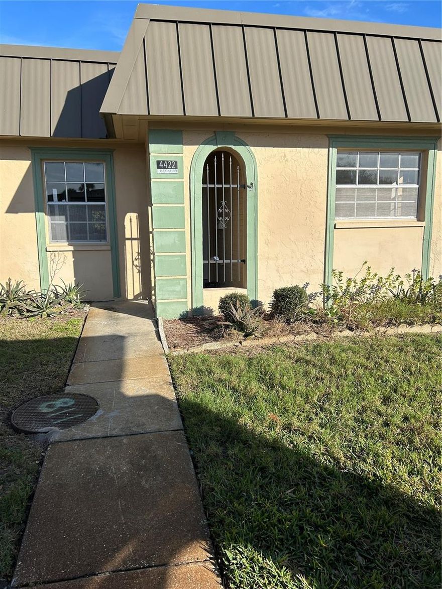 Welcome to Maintenance Free living in the quiet, relaxing enclave of Gardens of Beacon Square. You enter your new home with a covered,  Spanish style tiled portico. Recently renovated and updated, freshly painted with new floors and appliances, this 2 bedroom 2 bath condo located in the  gated 55+ neighborhood at The Gardens at Beacon Square. Bring your fishing gear as you are close to the Gulf of America and don't forget your golf clubs to use at the many public courses located nearby.  Close to shopping in downtown New Port Richey, not far from Tarpon Springs, beaches and Tampa Airport only 45 minute drive! Come see it today!