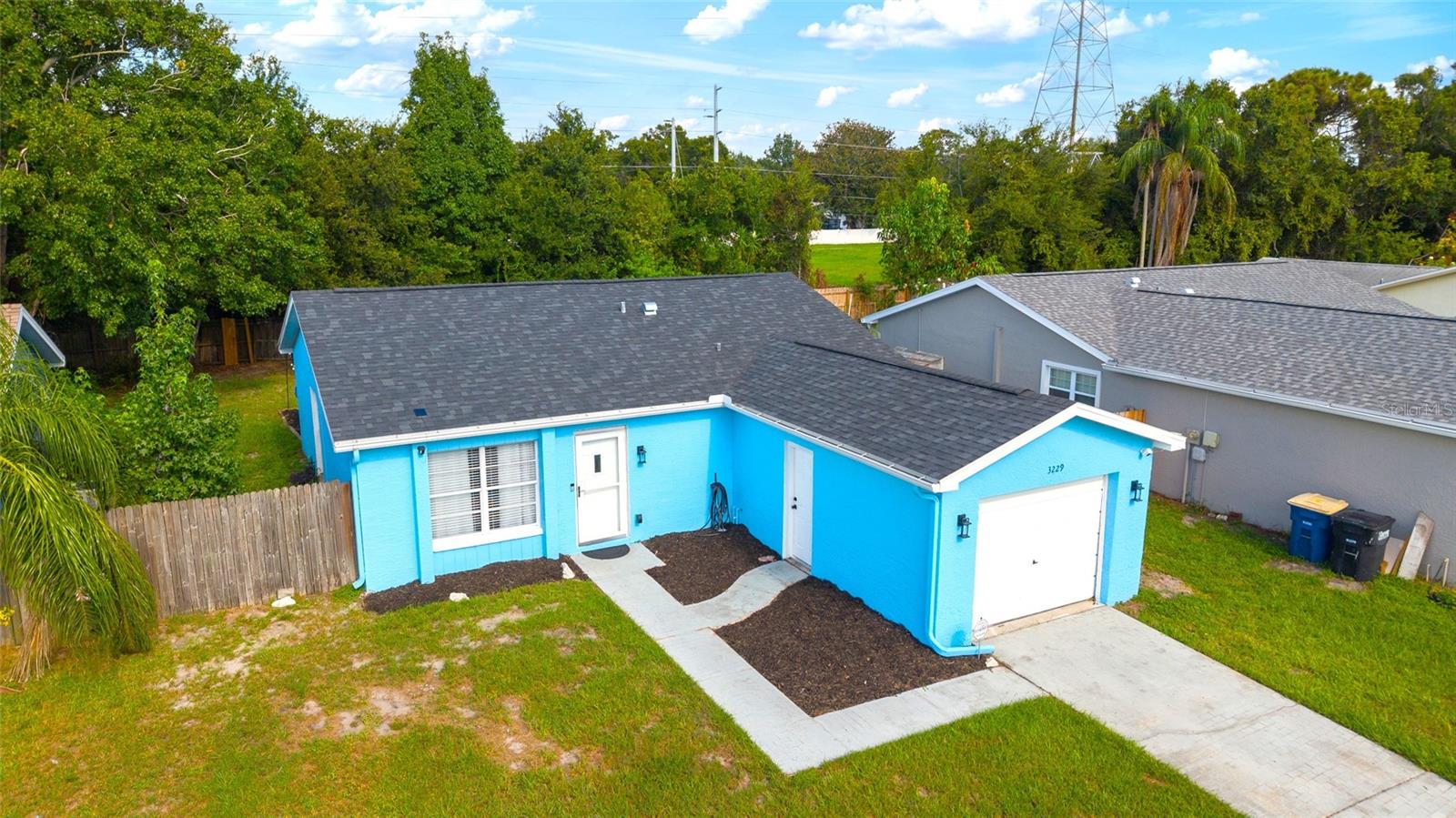 WELCOME TO THIS 1 LEVEL BLOCK HOME IN COUNTRYSIDE TRACT AT CLEARWATER FLORIDA. This home is priced to sell with many updates and upgrades. Inside the home is 1122 Sq feet and total is 1402 Sq Feet with the 1 Car Garage. *Add to short list to see before it is gone* The AC was replaced in 2020, The Roof replaced 2022, The Electrical done 2022. Join me to tour from the Fenced-In Yard with grilling area to the inside with 3 Bedrooms, 2 Full Updated Baths and Inside Laundry space. Updates Include: Fans in all the rooms with remote controls, Ceiling to floor Mirrors, Patio Outdoor Lighting, Gutters, Vinyl Flooring, Large Built-In Island with Quartz Countertop, Backsplash in Kitchen, Upgraded hallway lighting, Curtain and Blinds on the windows, Washer & Dryer Included, Freshly Mulched Beds, Upgraded Appliances in the Kitchen, Privacy in backyard, Cameras installed, Sidewalk, Mailbox and front County Light in the front yard, Garage has AC Unit, Storage room, Garage door opener and freshly painted, Exterior painted 2024, and more. Love the Water for sunbathing and or fishing or boating? Dunedin is 12 minutes away, Clearwater Beach is 27 minutes away, Safety Harbor is 12 minutes away, and Tarpon Springs is 16 minutes away. *You are close to Multiple Downtowns* Home is also near all shopping, restaurants, Pinellas County wonderful parks, places of worship, and the above average Elementary, Middle and High Schools. THERE ARE NO HOA OR CDD FEES HERE & ALSO FALLS IN ZONE X SO NO FLOOD INSURANCE IS REQUIRED! Give a text/call to tour today!