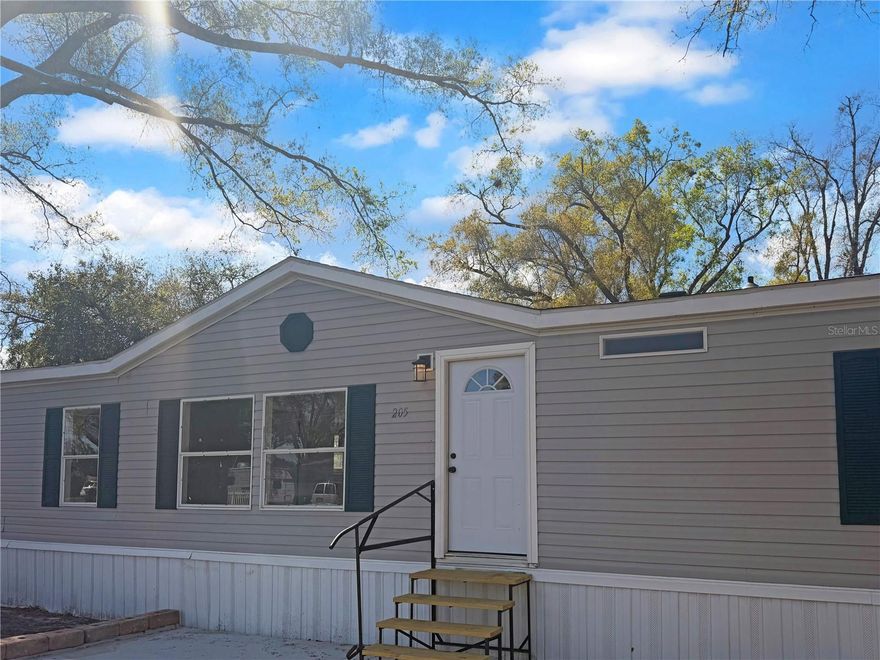 Completely remodeled 4-bedroom, 2-bath home in Auburndale, Florida featuring a bright open floor plan perfect for comfortable living and entertaining. The home offers updated lighting throughout and ceiling fans in every bedroom for added comfort. The split-bedroom layout places the primary suite separate from the other bedrooms, providing additional privacy. Both bathroom floors have been carefully sealed to help prevent moisture. Enjoy the mostly fenced backyard, offering space for outdoor activities, pets, or relaxing evenings. Conveniently located just off U.S. Highway 92, the home is only minutes from shopping, dining, and everyday conveniences. Photos may be edited or enhanced.