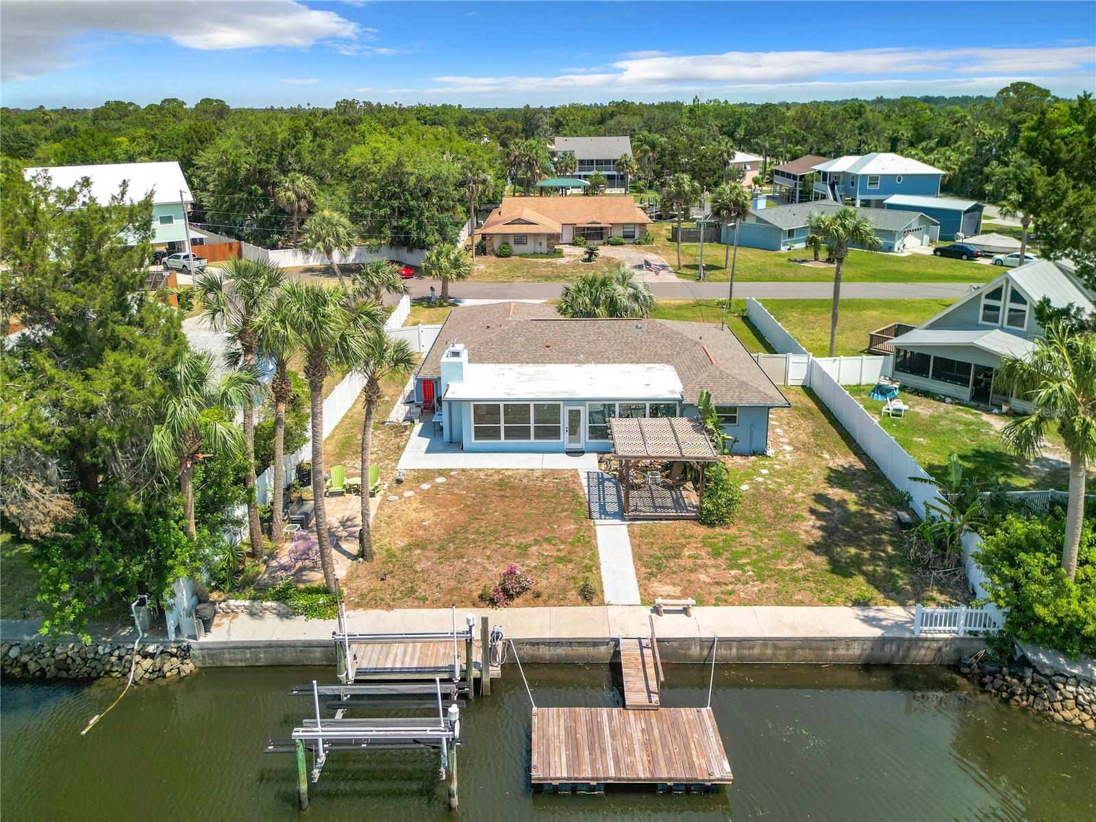 Your opportunity to make this home the way you want it! Welcome to waterfront paradise in Crystal River! This meticulously updated home boasts 3 bedrooms, two bathrooms, and an expansive 2,200 sqft of living space, providing ample room for relaxation and entertaining. Enjoy breathtaking views of the tranquil canal leading to the main river, with easy access to the springs and Gulf of Mexico. Watch manatees and dolphins play in your backyard year-round, creating a serene and captivating atmosphere. Immerse yourself in the beauty of nature with two koi ponds, one featuring a soothing waterfall, creating a peaceful retreat right at home. The fenced-in backyard offers privacy and security, while two sheds provide convenient storage for all your outdoor equipment and belongings. This home has a NEWER ROOF, NO BRIDGE, AND BOAT LIFT. Offering the ultimate in waterfront living, just minutes from Ft. Island Beach, public boat ramps, shopping, and local restaurants. Whether you're seeking outdoor adventure or simply relaxing in paradise, this home offers the perfect combination of comfort and convenience. Don't miss your chance to own this waterfront oasis in Crystal River. Schedule a showing today and start living the Florida dream!