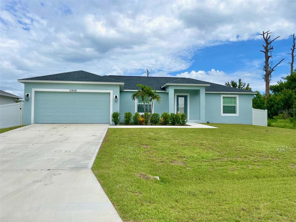 Photo of 11956 Waterman Ave, Port Charlotte, FL 33981 (MLS # D6148488)