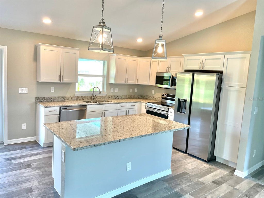 Photo of 11956 Waterman Ave, Port Charlotte, FL 33981 (MLS # D6148488)