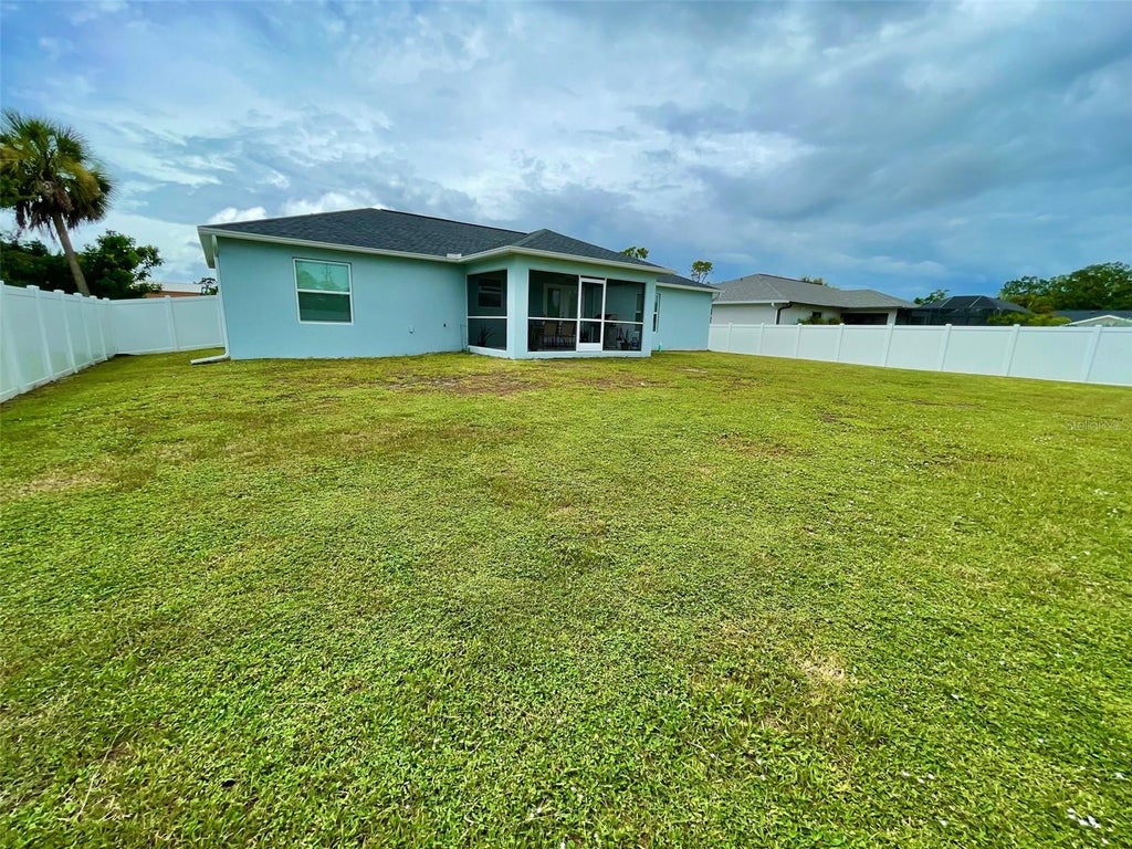 Photo of 11956 Waterman Ave, Port Charlotte, FL 33981 (MLS # D6148488)