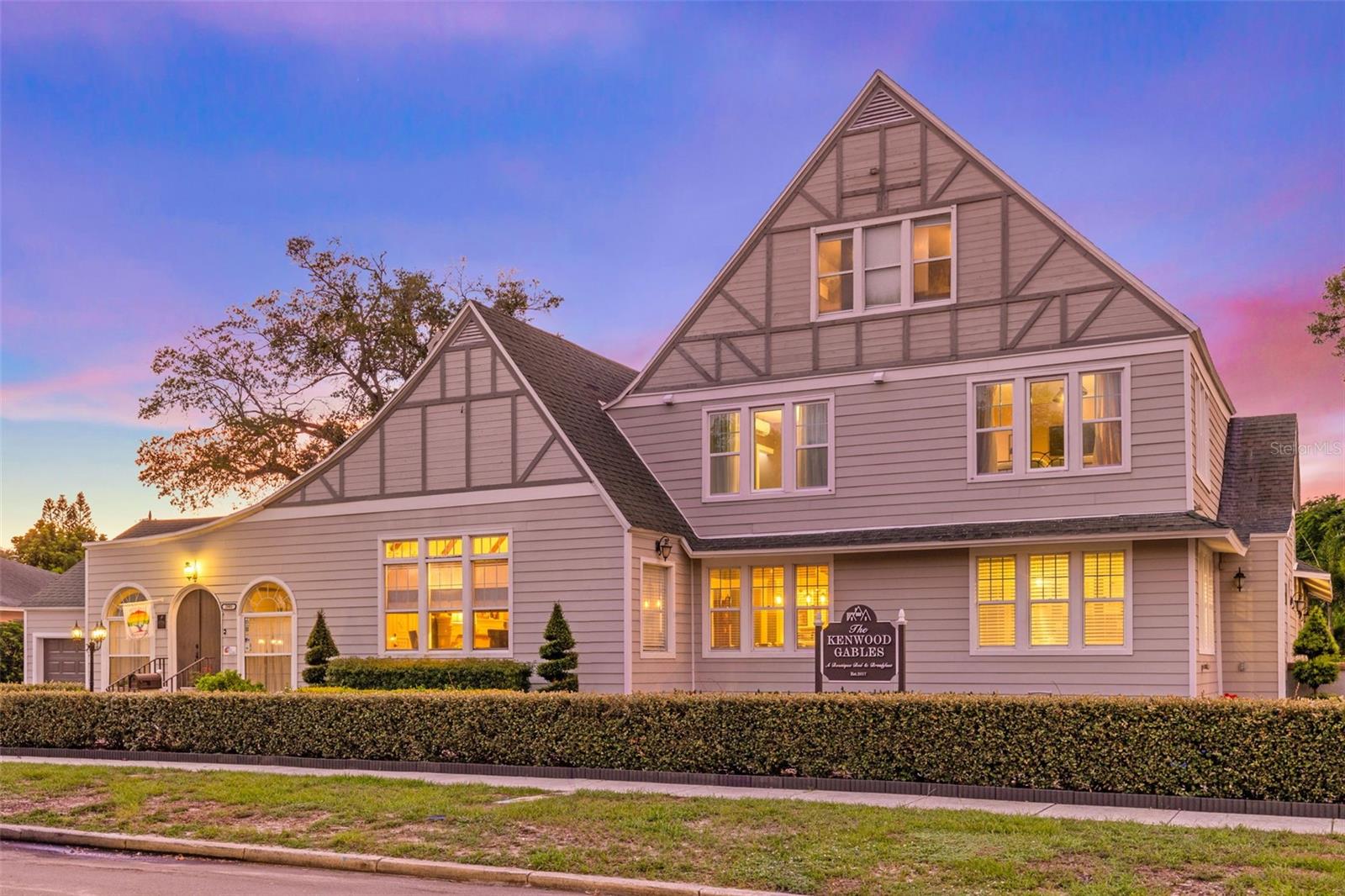 **HUGE Investment Rental Income Opportunity as this property holds a Bed & Breakfast license!! Brand New Roof Installed May 2025 with a transferable warranty.
Welcome to the enchanting world of historic elegance! Step into the timeless beauty of this extraordinary 1936 Tudor revival home. Nestled in the beloved neighborhood of Historic Kenwood, this magnificent estate boasts seven bedrooms, eight bathrooms, and an enticing heated in-ground pool. As you enter through the grand foyer, you'll be greeted by an atmosphere of old-world charm and warmth. The rich hardwood floors, intricate detailing, and high ceilings effortlessly blend with modern amenities, creating a harmonious fusion of the past and present. The spacious living areas are perfect for both grand entertaining and intimate gatherings. The formal dining room exudes sophistication, while the cozy library that currently being used as a secondary dining room, offers a quiet retreat for intellectual pursuits. The majestic fireplace in the living room is a delightful centerpiece, inviting you to relax and unwind. The chef-inspired kitchen is a culinary masterpiece, featuring top-of-the-line appliances, ample storage space, and a charming breakfast nook. Prepare delectable meals while enjoying the picturesque views of the lush landscaped gardens. Retreat to the seven well-appointed bedrooms, each offering a serene sanctuary for peaceful nights rest. There are two master suites on the first floor and both are a true oasis, complete with a luxurious en-suite bathroom, and a private sitting area. Indulge in the ultimate relaxation experience in any of the eight beautifully designed bathrooms, featuring modern fixtures and elegant finishes. Whether you prefer a rejuvenating shower or a tranquil soak in the tub, these bathrooms cater to your every need. The outdoor space is a true paradise, encompassing impeccably manicured gardens, a charming patio and a sparkling heated in-ground pool. Dive into the refreshing waters, bask in the sun on the poolside lounge chairs, or gather with loved ones for unforgettable poolside barbecues. Located in a prime historic neighborhood, this Tudor home offers easy access to renowned schools, trendy shops, and fine dining establishments. Immerse yourself in the rich history of the area, while enjoying the modern conveniences of today. Don't miss this rare opportunity to own a piece of history with the added luxury of a heated in-ground pool. Schedule a private tour and let this 1936 Tudor home transport you to a world of timeless elegance, unparalleled luxury, and endless enjoyment. The main house consists of 6 bedrooms and 7 bathrooms. The guest house adjacent to the pool area is a one bed, one bath unit. Currently this property is an operational licensed Bed and Breakfast.