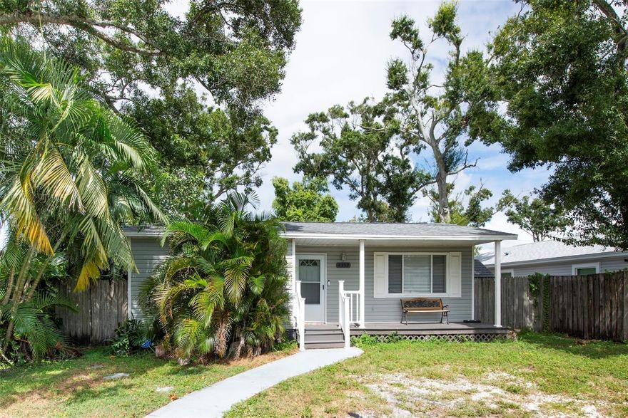 Move-in ready and full of updates, this well-maintained St. Petersburg home offers modern comfort in a growing and still affordable neighborhood. Featuring an updated kitchen with stainless steel appliances including a high-end KitchenAid bottom-freezer refrigerator and dishwasher, laminate flooring throughout, updated bathroom, and a recently installed permitted interior laundry closet for added convenience. Major upgrades include a new electric panel in 2022, roof replacement in 2020, new insulation in the attic in 2024, and an incapsulated crawl space with dehumidifier.  The fully fenced-in  backyard is designed for outdoor living and entertaining with a large patio deck, screened-in lanai, dedicated grilling area, and two sheds, one equipped with electricity, ideal for tool storage, and an additional refrigerator. A retractable rear gate opens to a private alley, providing extra functionality. The home was tented in 2024 with a full warranty that was recently renewed and is transferable to new owner and receives quarterly pest control treatments. Located just one block from Raymond H. Neri Park, which offers lakeside walking trails, a playground, restrooms, and future additions including a dog park and baseball field scheduled for completion in early 2026. This home is conveniently located close to Disston Plaza shopping, just 10 minutes to the Harbor, 15 minutes to the beaches, and 20 minutes to Tampa International Airport. Don't miss your opportunity to get into this vibrant and up-and-coming neighborhood.