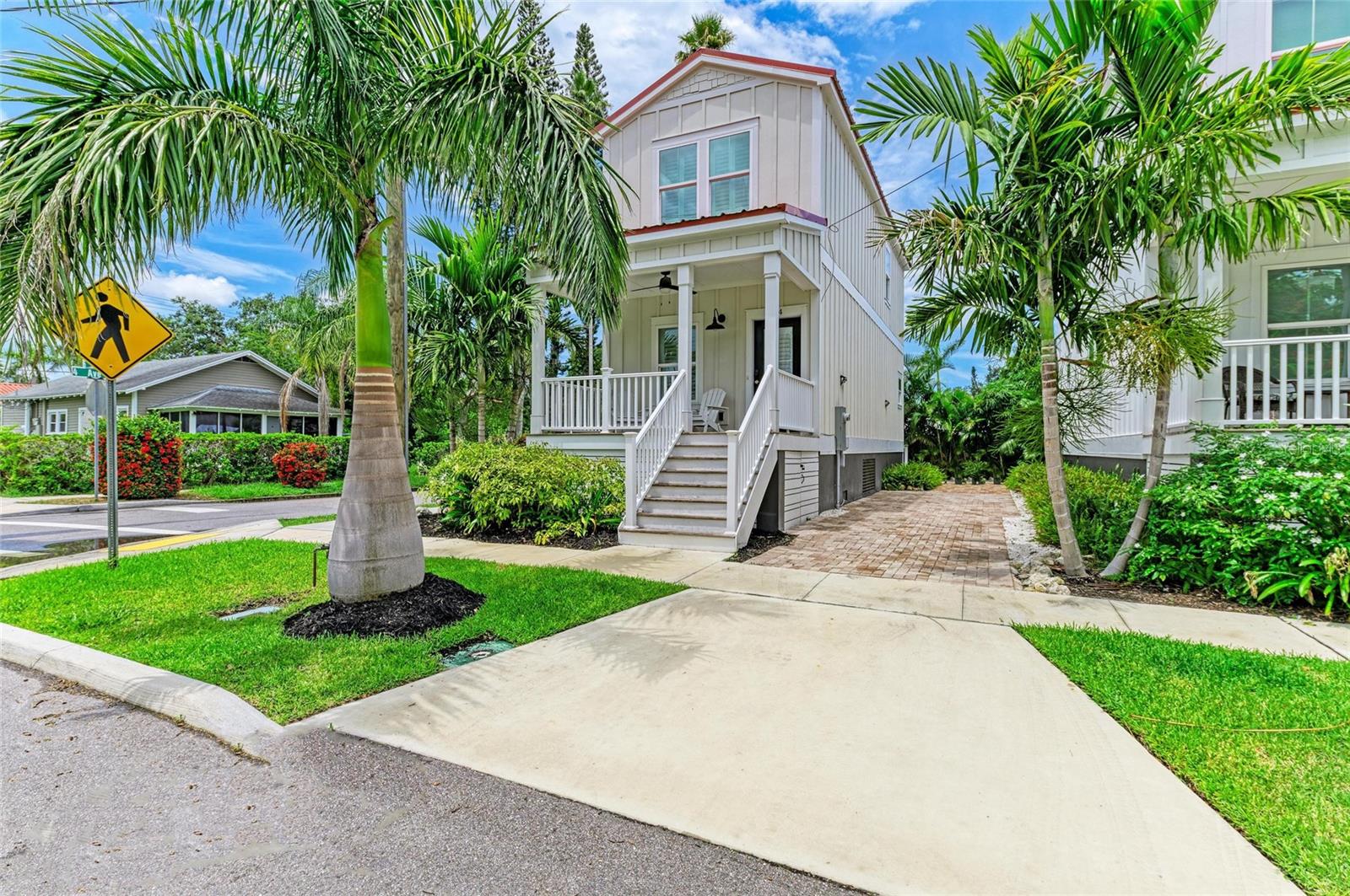 Welcome to your gorgeous 2 year old corner cottage nestled in the sought-after Castaway Cottages community—your slice of Caribbean-inspired charm right across from Bradenton’s scenic River Walk. Immerse yourself daily in waterfront views, leisurely evening strolls, and nearby dining. This land condo is one of only eight tailor-made cottages, built in 2023 by Hamilton Constructors, offering stylish coastal-living with modern finishes and minimal maintenance. Monthly dues are a low $35 for those opting out of lawn service and $85 for those opting in to lawn service. 2 bedrooms with ensuite baths upstairs + ½ bath on the ground level for guests. 1,244 sq ft of breezy, open living space built for Florida living: metal roof, impact-insulated windows, cement siding with lush, low-care landscaping, and two dedicated parking spots. Relax on the 8-ft deep front porch, perfect for watching the world go by in your quaint downtown setting. No lease restrictions — ideal for full-time residence, seasonal living, or vacation rental flexibility. This neighborhood is buzzing with artistic energy and local hotspots. Less than 10 miles to gorgeous Anna Maria Island and the gulf beaches. Conveniently located between St. Pete and Sarasota and the gulf coast has to offer.