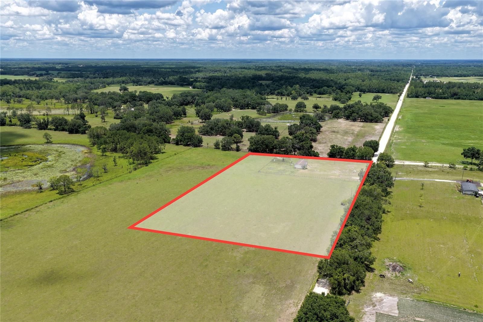 This beautiful property offers breathtaking views of a peaceful pond, and a welcoming country atmosphere. Fully fenced and gated for privacy and security, the land comes equipped with all utilities and is mobile home ready, making it easy to settle in and start enjoying rural living right away. Surrounded by friendly neighbors who raise horses and longhorn cows.