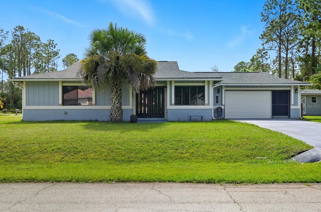 Photo of 121 Point Of Woods Drive, Palm Coast, FL 32164 (MLS # FC313107)