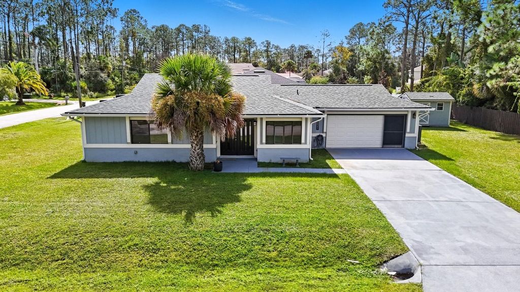 Photo of 121 Point Of Woods Drive, Palm Coast, FL 32164 (MLS # FC313107)