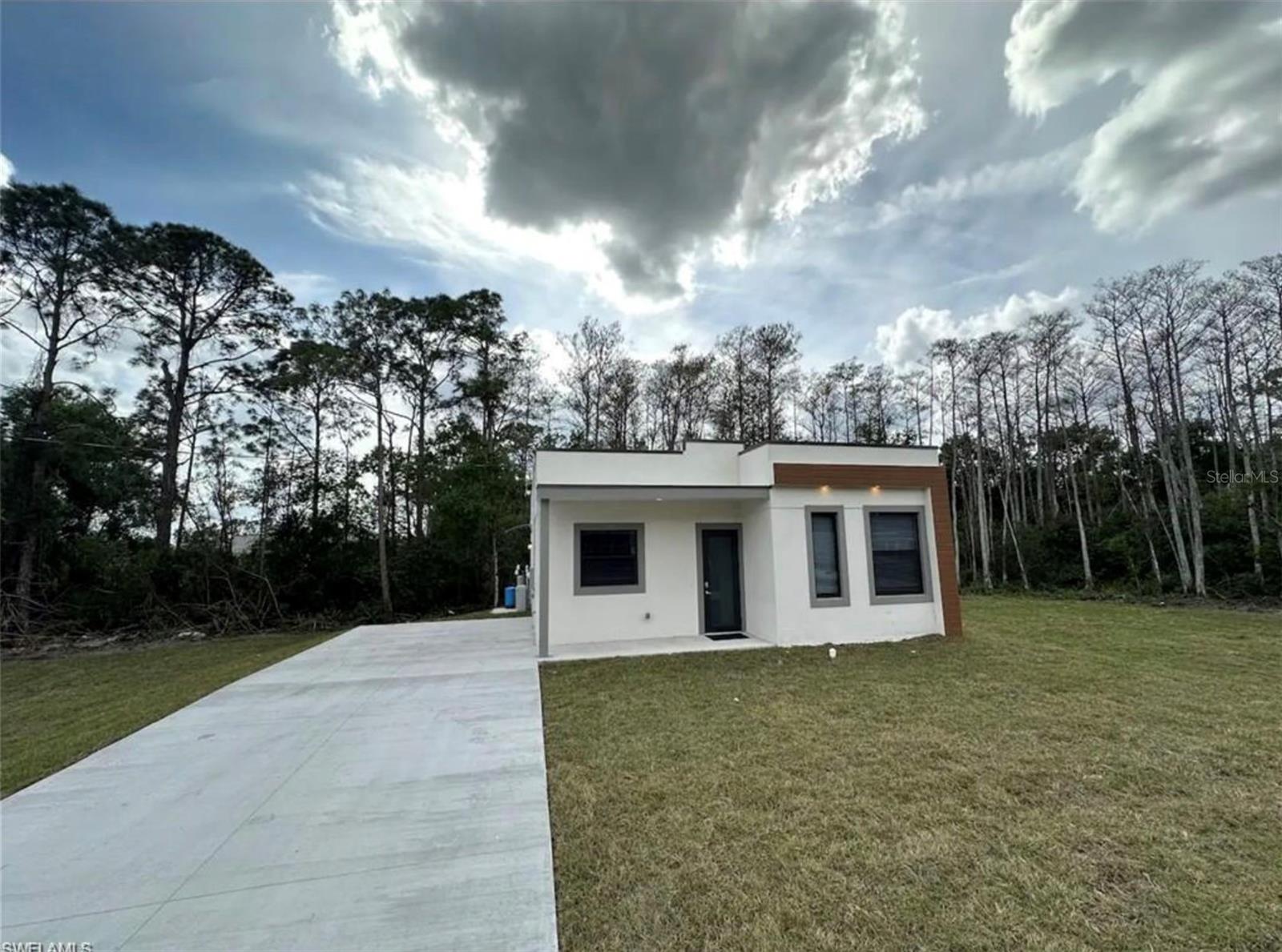 **BRAND NEW HOME** Welcome to your dream sanctuary. Modern design plus unparalleled security. Cutting-edge construction offering a 100% Concrete Bunker-style residence that stands as a fortress of tranquility. Impact-resistant windows usher in natural light, highlighting the sleek quartz countertops and 100% waterproof flooring, blending durability with luxury. It's an architectural gem designed for the ultimate peace of mind, perfect for the first-time homeowner. Images are from model home. SIMILAR MODELS APPRAISED OVER 300K!