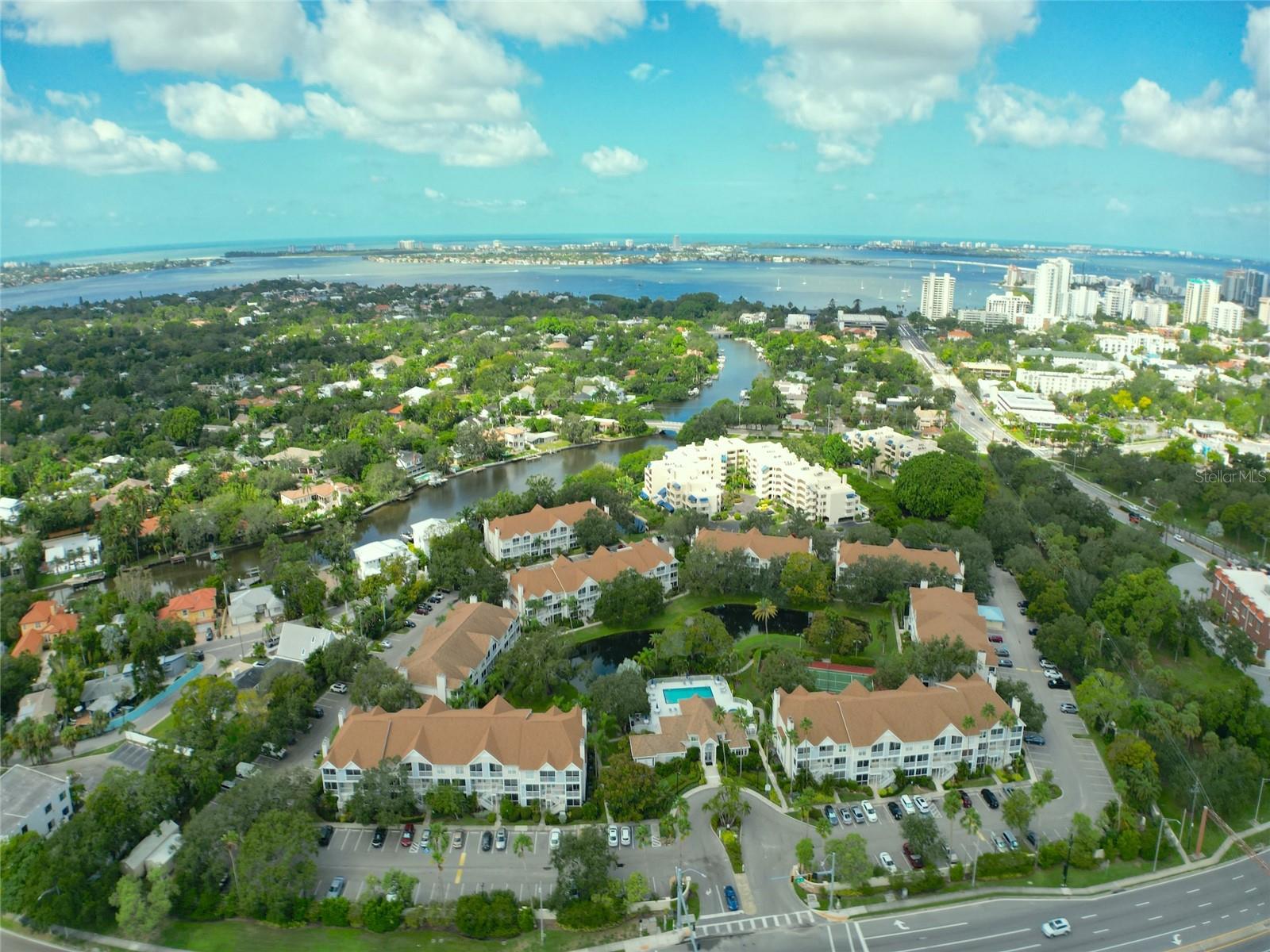 FIRST MONTH OF RENT IS FREE! EXCELLENT LOCATION! Light and bright 2 bedroom condo on the water is just a few blocks to the Sarasota Bayfront, Selby Gardens, Sarasota Memorial Hospital and downtown Sarasota. Enjoy restaurants, entertainment and shopping. Across the street is the current Sarasota High School, historic High School Art Museum and Publix, just over the Ringling Bridge is Lido Key Beach and St. Armands Circle. This gorgeous 2 bedroom and 2 and a half bath FULLY FURNISHED condo offers a large great room, an upgraded kitchen, full size washer and dryer, two large bedrooms with en-suites attached and a screened lanai off the great room and a second one accessed from the bedrooms. You can walk out to a dock each morning, sip coffee and watch the manatees swim by. Enjoy a kayak launch, a place to fish, a heated pool, hot tub, tennis/pickleball and a clubhouse with a fitness center, showers, kitchen and library. The grounds have a suburban resort atmosphere. All this within steps of downtown and the bayfront--and a bike-ride to the beautiful Gulf Beaches. Sarasota County's Legacy Trail has now been extended two blocks from Central Park II. So much to enjoy, call today!