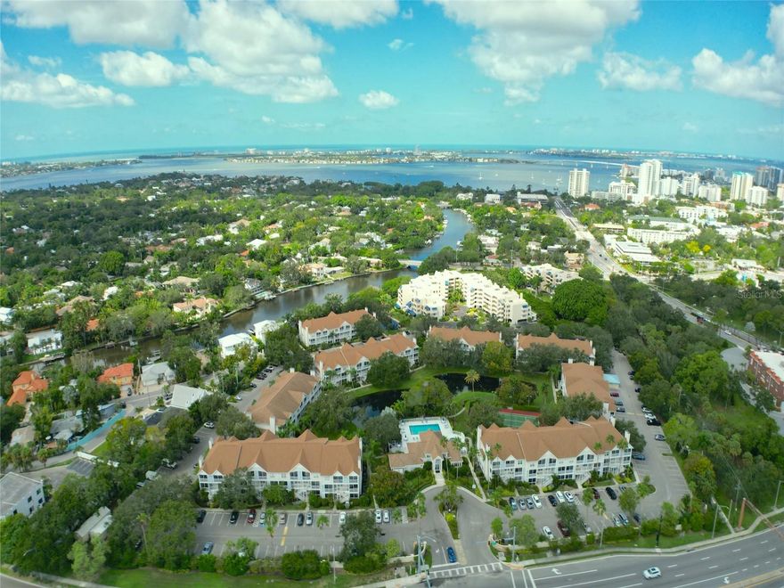FIRST MONTH OF RENT IS FREE! EXCELLENT LOCATION! Light and bright 2 bedroom condo on the water is just a few blocks to the Sarasota Bayfront, Selby Gardens, Sarasota Memorial Hospital and downtown Sarasota. Enjoy restaurants, entertainment and shopping. Across the street is the current Sarasota High School, historic High School Art Museum and Publix, just over the Ringling Bridge is Lido Key Beach and St. Armands Circle. This gorgeous 2 bedroom and 2 and a half bath FULLY FURNISHED condo offers a large great room, an upgraded kitchen, full size washer and dryer, two large bedrooms with en-suites attached and a screened lanai off the great room and a second one accessed from the bedrooms. You can walk out to a dock each morning, sip coffee and watch the manatees swim by. Enjoy a kayak launch, a place to fish, a heated pool, hot tub, tennis/pickleball and a clubhouse with a fitness center, showers, kitchen and library. The grounds have a suburban resort atmosphere. All this within steps of downtown and the bayfront--and a bike-ride to the beautiful Gulf Beaches. Sarasota County's Legacy Trail has now been extended two blocks from Central Park II. So much to enjoy, call today!