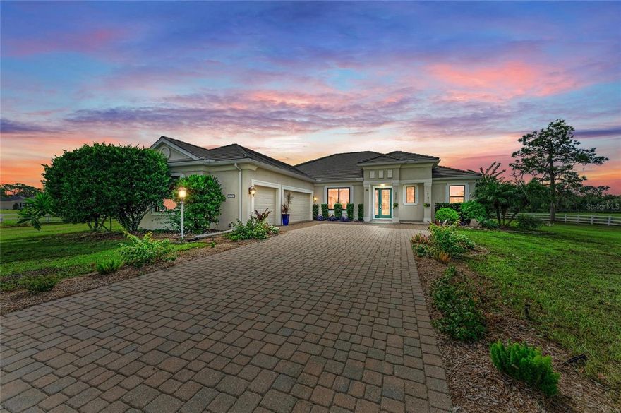 Exquisite Equestrian Estate in Sarasota Ranch Club.
Neal Signature home on 8.7 acres in the gated community of Sarasota Ranch Club. This elegant residence features a spacious great room floor plan, chef’s kitchen with stone countertops, stainless appliances, gas range, and wine cooler, plus a 1st floor luxurious owner’s suite with spa-like ensuite bathroom, and two spacious walk-in Closets. Additional first floor highlights include two guest bedrooms, a den or another bedroom on the first level, and a fourth bedroom upstairs or bonus suite.  The Outdoor Pool Area features a Waterfall Pool with expansive Paver Deck, a Sun-Shelf for Sunbathers, Covered Porch Area, and a Newly Screened Lanai. This home also has NEW ANDERSEN WINDOWS, 2 NEW AC UNITS, Tankless Hot water Heater, Propane Gas Appliances, Wood Floors in all Bedrooms, Freshly Painted Interior, Security Sys, Gated, Paver Driveway, 3-Car Attached Garage, Concrete Tile Roof, Culligan Water Filtration System, Community Gate, and so many more upgrades to mention.

For the Equestrian, enjoy two fully white vinyl fenced, paddocks with a pond and a well-equipped Block/Stucco/Tile Roof, Center Aisle Barn with two stalls, (Could easily be converted to 4-6 Stalls), tack room, and space for expansion. For Dog Lovers the entire property is dog-fenced as well.  Sarasota Ranch Club offers 640 acres of natural beauty with private bridle trails, just 20 minutes from Sarasota’s award-winning beaches, dining, and Airports, Hospitals, and Cultural Attractions.