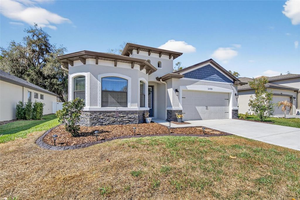 Photo of 11439 Crowne Pointe Street, New Port Richey, FL 34654 (MLS # TB8481108)