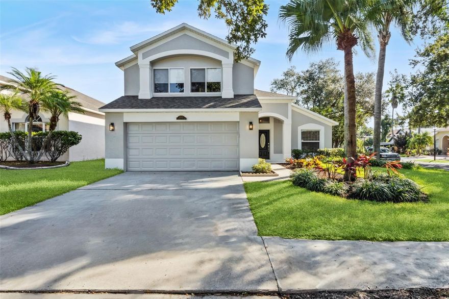 One or more photo(s) has been virtually staged. Modern elegance meets relaxed Florida living in this beautifully updated pool home located in the gated Devlin Green community of Hunters Creek. A freshly painted exterior, brand-new sod, and lush landscaping create instant curb appeal, while the sophisticated interior showcases impeccable design and attention to detail throughout. The formal dining room welcomes you at the entry, setting the tone for the stylish updates that continue across the home. The chef-inspired kitchen features ceiling-height shaker cabinetry, quartz countertops, stainless steel appliances, a sleek range hood, herringbone backsplash, and a large center island with pendant lighting—perfect for casual dining or entertaining. A spacious walk-in pantry adds convenience and organization. The open-concept layout flows seamlessly into the dining area and family room, highlighted by wood-look tile flooring and designer light fixtures. The first-floor primary suite offers a private retreat with a quartz double-sink vanity, frameless glass shower, soaking tub, and custom tile flooring. It also includes two closets—a walk-in with custom built-ins and a second with a modern barn door for added style and function. A remodeled half bath and a laundry room with decorative tile flooring add charm and practicality. Upstairs, three additional bedrooms and a versatile loft provide comfortable space for family, guests, or a home office. Smart features include a WiFi-enabled coded front door lock and a Daikin One+ Smart Thermostat for remote access, adaptive comfort control, and energy efficiency. The garage includes a utility sink conveniently located off the laundry area, ideal for household projects or everyday use. Step outside to your private oasis with a screened pool that was freshly resurfaced and a newly painted pool deck (2025), all surrounded by mature trees and manicured landscaping. Major updates include a new roof (2020) and AC system (2022) for peace of mind. Enjoy the unmatched lifestyle of Hunters Creek, one of Central Florida’s most desirable master-planned communities, offering parks, playgrounds, tennis and basketball courts, dog parks, soccer fields, scenic walking trails, and year-round neighborhood events—all just minutes from top-rated schools, shopping, dining, and major attractions.
