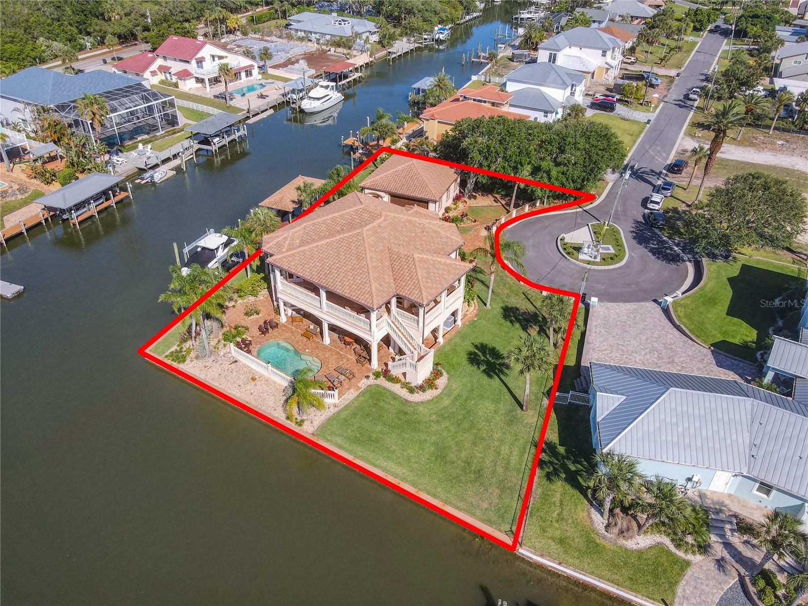 Whether you are an avid boater looking for paradise with easy access to open water, or a car enthusiast looking for a luxury home where you can keep your collection close – this home has everything you are looking for. 298 Feet of DEEP WATER, 3 Boat lifts, garage parking for 6 cars, 3,196 sq.ft. of living area, and an elevator - this home is truly spectacular.
With nearly 800 sq.ft. of balcony space overlooking the Intracoastal Waterway, a glass of wine, and a sunset – and you will see exactly why residents have chosen to call this area home. Perfectly situated at the end of one of the most desirable cul-de-sacs in Ponce Inlet, you are met with a magnificent home featuring a chefs kitchen complete with butler pantry, double island, and a gorgeous gas range.
While the focal point is definitely the view, the back yard features a heated, salt-water pool that serves as the center of the outdoor entertaining area. With a summer kitchen and several seating areas, this home offers the ultimate in Florida living.
Recent updates include new hurricane shutters and a whole house generator.