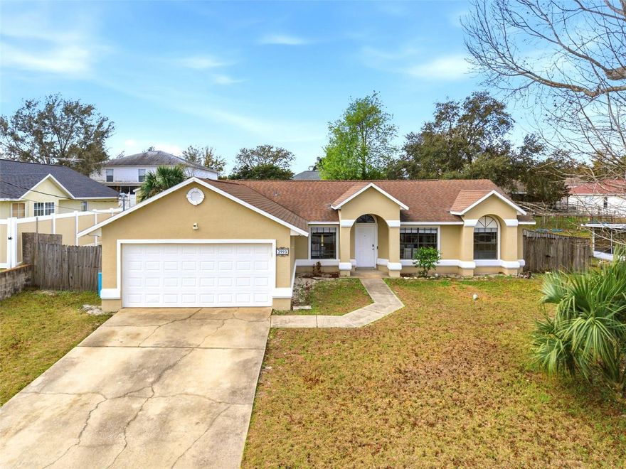 Welcome to this beautifully updated 3-bedroom, 2-bathroom home located at 2993 Lagoon Deltona Ave, offering comfort, convenience, and no HOA or CDD fees. This well-maintained property features a separate living room and a dedicated dining area off the kitchen, creating a functional layout perfect for everyday living and entertaining. The kitchen has been fully upgraded with new shaker-style cabinets, granite countertops, and stainless steel appliances, giving the space a modern and clean look. Throughout the main living areas, the floors have been upgraded to durable vinyl, providing both style and easy maintenance. Both bathrooms have also been updated with new vanities, granite countertops, modern fixtures, and mirrors, creating a refreshed and polished feel throughout the home. Step outside to enjoy the spacious fenced-in backyard, perfect for pets, gatherings, or simply relaxing. The property also includes a shed that conveys with the sale, providing additional storage. A 2-car garage and a large driveway with plenty of parking for residents and guests. Major updates include a new roof installed in September 2022, A/C and air handler replaced in September 2022, and a water heater installed in 2014, giving peace of mind to the new owner. Conveniently located, this home is less than 2 minutes from Aldi, Dollar Tree, and AdventHealth Hospital. Within 5 minutes you'll find I-4, Chipotle, Subway, Wawa, and Burger King, and just 7 minutes away are Epic Theaters, the YMCA, and the Deltona Club Golf Course. This home offers the perfect combination of modern updates, a great location, and no HOA restrictions, making it an excellent opportunity for homeowners or investors alike.