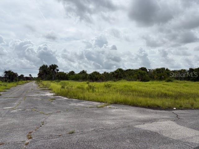Investment property for future use on this 1/4 acre lot. Utilities are currently not present, however, electric lines are not far away. It does not appear that the lot is currently buildable at this time. It is a recorded Plat with roads in, just no other infrastructure