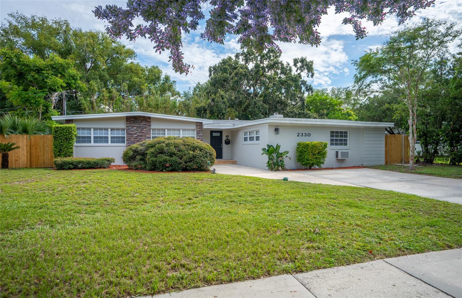 Modern luxury meets Winter Park charm — fully renovated 4BR/2BA with $20K seller credit with full price purchase! This beautifully reimagined 4-bedroom, 2-bath home has undergone a complete transformation. Every detail thoughtfully designed and executed. From brand-new plumbing, electrical, and HVAC systems, to a stunning new floor plan created by an international architect, this home blends modern functionality with timeless charm.
Step inside and be greeted by an open concept living space filled with natural light. A striking oversized window frames the outdoors like a work of art, while the preserved original stone fireplace adds warmth and character to the living and dining area. The brand-new kitchen flows seamlessly into the space, making it perfect for gatherings and family moments.
Designed for today’s lifestyle, the home now features a private office, ideal for remote work or study, and a newly added bedroom that expands comfort and flexibility. The dedicated laundry room and thoughtful storage solutions bring convenience to daily living.
Outside, the enclosed porch invites you to enjoy Florida evenings year-round, whether it’s sipping a glass of wine or hosting friends in a cozy, bug-free setting.
Nestled on a quaint, family-friendly street just steps from a neighborhood school, this home offers both peace and practicality. It is also located within the highly desirable Winter Park school district, with access to top-rated public schools—making it an ideal choice for families seeking both quality of life and excellent education opportunities. The surrounding area, while rich in tradition, is experiencing a wave of new builds and renovations—making this not only a beautiful place to live, but also a smart investment in one of Winter Park’s most desirable and appreciating communities.
Added Bonus: With a full-price purchase, the seller will contribute $20,000 towards your closing costs or to buy down points on your interest rate—your choice! This makes an already stunning home an even more incredible opportunity.
Don’t miss the chance to make this fully renovated Winter Park gem yours. Schedule your private tour today and experience the perfect blend of comfort, style, and location.
