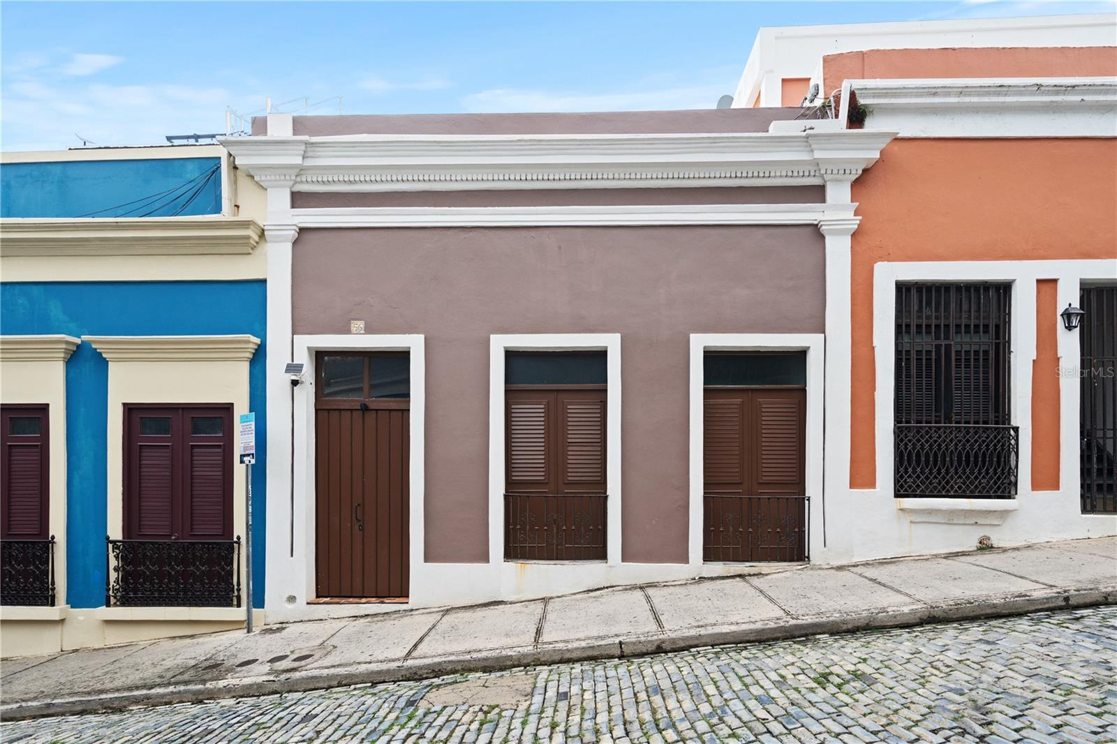 Historic Mansion in the Heart of Old San Juan
This unique historic mansion is nestled on a 356 square meter lot in a prime location within Old San Juan, a UNESCO World Heritage Site. Originally constructed in 1840 as the residence of a Spanish officer, this grand “Casona” spans approximately 5,324 square feet (4,130 interior), and currently consists of a two-story colonial structure featuring one main unit, two apartments, and one studio.
The property offers flexible use: it can be maintained as four separate residential units or converted into a single-family residence with up to 7 bedrooms and 4 bathrooms, complemented by three open terraces.
Enjoy spacious bedrooms, charming interior courtyards, open-air patios, and private rooftop terraces—perfect for morning coffee or unwinding in the afternoon while taking in the picturesque views of the Old City.
Additional highlights include:
• Oversized windows for abundant natural light and excellent cross-ventilation
• Soaring 16–18’ ceilings
• Water cistern ("aljibe")
• Classic Spanish architectural elements: exposed brick, preserved “ausubo” wood beams, original semicircular “soles truncos,” and intricate ironwork
Located just steps from iconic landmarks such as Castillo San Felipe del Morro and Castillo San Cristóbal, and close to art galleries, restaurants, and boutique shops, this home offers the perfect blend of historic charm and urban convenience.
Zoned Commercial C-3, offering both residential and commercial potential.