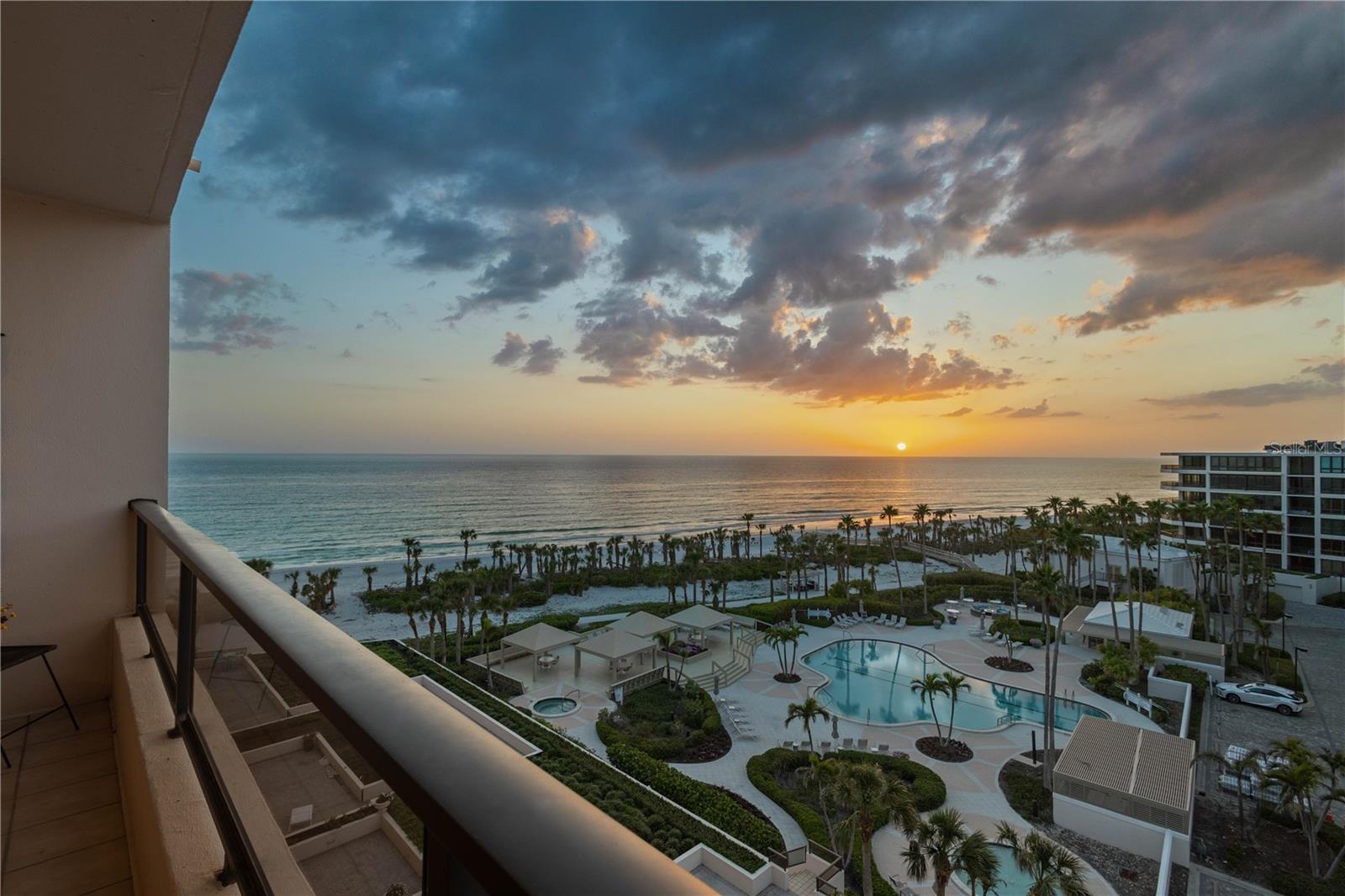 Welcome to paradise! This 3 bedroom floor plan offers Northwest and Southeast terraces boasting direct beach and sunset views from the great room and primary suite along with City and Bay views from the kitchen, den and guest bedroom. Floor to ceiling sliders showcase the big views at both ends and provide a bright welcoming atmosphere. The kitchen features a large center island, breakfast nook, granite counters, built-in desk, abundant cabinet space and all the conveniences to create memorable meals. Retreat to the primary suite where owners are pampered with terrace access, sunset views over the water, a walk-in closet and a spacious primary bath with separate shower, garden tub, dual vanities and water closet. Visitors will be comfortable staying in the ensuite guest bedroom that shares the Southeast terrace with the kitchen and 3rd bedroom that can also be used as a den. Other highlights include a separate laundry room with sink, an under building parking space, high speed fiber optic internet access and a smartphone app for easy tenant/guest access to the gates and building. Located behind the prestigious gates of The Longboat Key Club on the desirable South end of Longboat Key, owners will enjoy being minutes from the fine dining and shopping on St. Armands Circle in addition to the close proximity to Southwest Florida’s cultural hub of downtown Sarasota. At the Sanctuary, you will be part of 18 incredible beachfront acres with trails, an Olympic sized heated pool and spa, lighted tennis courts, a fitness center, onsite management, 24-hour manned security gate and a club house with planned activities. Become a member of the Longboat Key Club and partake in the superior golf courses, 6 private restaurants, spa and wellness center and other AAA four-diamond beach resort offerings. Roof replaced in 2023, Elevators modernized in 2022, drainpipes re-lined in 2024 and pool decking replaced in 2024. Building passed the Milestone Structural Integrity Inspection.