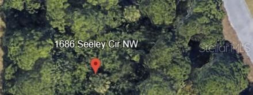 This 0.4-acre lot in Port Malabar Unit 39 offers a fantastic opportunity to build your dream home in a peaceful, established neighborhood. Located in Brevard County, this property is conveniently situated near schools, shopping, and major roadways, providing easy access to all that Palm Bay has to enjoy. With no HOA or association fees, you have the flexibility to design your home to suit your needs and preferences. Whether you're looking to invest or create your ideal living space, this lot presents a blank canvas ready for your vision.