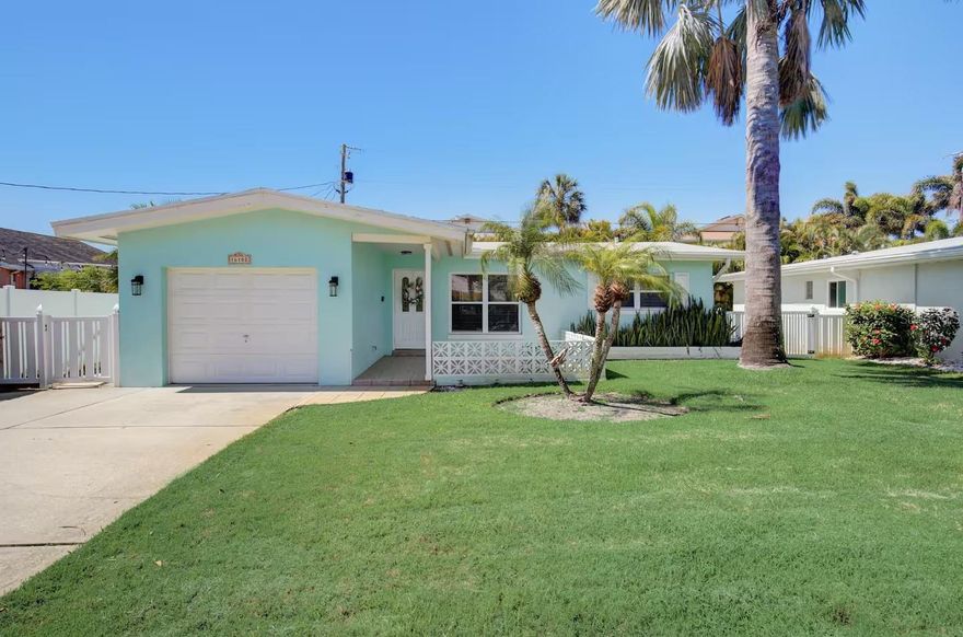 This beautifully updated 2-bedroom, 2-bath beach home is just steps (a half a block) from the sand and offers the perfect blend of location, comfort, and style. Enjoy easy beach access, convenient parking, and a peaceful setting. No HOA, and is being offered partially furnished. Short Term Rentals are allowed. The home features a spacious Florida room, ideal for relaxing or entertaining, along with ample storage in the garage. Inside, the property has been completely remodeled with a brand-new kitchen featuring elegant white quartz countertops, brand-new cabinetry, and a farmhouse-style stainless steel sink that blends timeless character with modern function. The flooring features 4’ x 4’ Miami-style porcelain tile throughout the home, delivering a clean, sophisticated coastal aesthetic. The kitchen also includes new stainless steel appliances including a new refrigerator, new dishwasher, new stove/oven, new microwave and a new ventilation hood, completing the suite of updated appliances. All new brushed nickel faucets. Both bathrooms have been refreshed with new vanities, and the home includes new attached TVs, a new washer and dryer, new interior doors with brushed nickel door handles, also new baseboards and trim, fresh interior paint, and some new windows. Additional upgrades include a new air conditioner, new ceiling fans, and a new hot water heater, providing modern efficiency and peace of mind. The property is also conveniently located near the Intracoastal Waterway, offering access to boating, fishing, and waterfront dining. This move-in-ready beach home delivers modern updates, serene surroundings, and one of the most desirable locations on the Gulf Coast. Experience the best of Redington Beach living. Schedule your private showing today and start living the beach life you deserve!