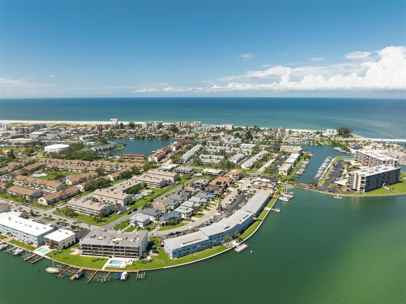 Experience waterfront living in this beautifully remodeled 2-bedroom, 2-bath first-floor condo on Treasure Island’s sought-after Isle of Capri. With 1,245 square feet of open living space, this light-filled home has been thoughtfully updated throughout. The stylish coastal kitchen features quartz countertops, shaker-style cabinetry, and stainless steel appliances, while both bathrooms have been tastefully renovated with elegant finishes. Enjoy sweeping Intracoastal views from the spacious living and dining areas. The well-maintained, pet-friendly community offers a waterfront patio with boat dock, kayak storage, gas grill, assigned storage unit, and convenient parking. Located just minutes from Treasure Island’s beaches, restaurants, shopping, and local parks with tennis, pickleball, and a dog park. Whether you're seeking a full-time residence, seasonal getaway, or investment property, this one is move-in ready and beautifully maintained.