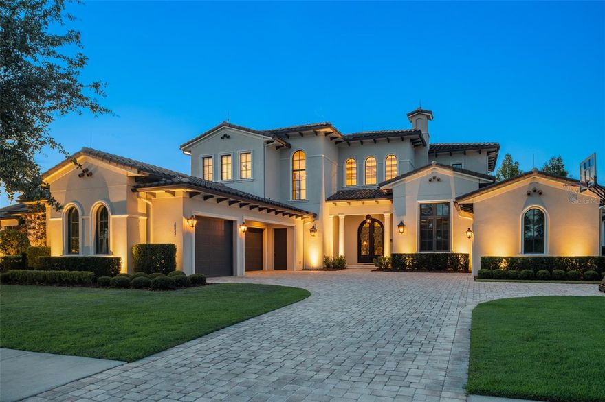 Welcome home to this beautiful custom-built oasis located in Lake Nona Golf and Country Club. This spectacular 5 bedroom, 5 full and two half-bath DeVoe custom home offers water views, lush landscaping, and an open floor plan. The entry way leads into an expansive family room with high ceilings, millwork, and 10 ft sliding glass doors that create endless views towards the saltwater pool and pond. The home boasts an incredible chef’s kitchen with top-of-the-line appliances, and a hidden walk-in pantry. The luxurious master suite includes an oversized bathroom complete with shower, soaking tub, and double vanity. The master suite also features a large custom closet. Also located on first floor is a secondary bedroom with ensuite bathroom, a dedicated office that is currently being used as a man cave, a hidden walk-in wine cellar, a small bill pay/office adjacent to the kitchen and a newly converted indoor/outdoor Florida room. This lovely home truly has it all, including both a downstairs laundry room and an upstairs laundry closet, so you need never carry laundry up or down the stairs. On the second floor you will find a secret door to a 5th bedroom - push the bookcase in and you are in a secret room which has high ceilings and an ensuite bathroom. The two additional upstairs bedrooms are generous in size and are also both ensuite. But the best is still to come: a newly enclosed Florida room features a dedicated AC unit and has dual sliders to open up on cool days. Kick back, relax and enjoy your free time in a truly one-of-a-kind resort style pool and spa. No expense was spared in building this beautiful home. The oversize 3 car garage is perfect for all your vehicles plus the additional single car garage doubles as a home gym. With complete home automation from Control 4 you can turn on lights or TVs from the touch of a button. The front gas lanterns give this home a truly unique look, and the rear built in fire pit is perfect for those chilly Central Florida Evenings.  Lake Nona Country Club offers world class golfing, and neighborhood amenities such as housekeeping, concierge, and 24-hour security. Lake Nona is located near Orlando International Airport, and only a short drive from downtown Orlando, Winter Park, and the attractions.