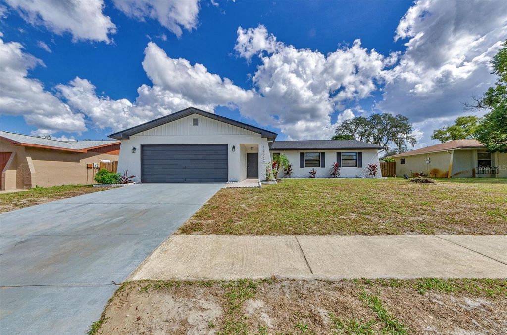 Photo of 12920 Walnut Tree Lane, Hudson, FL 34669 (MLS # TB8440796)