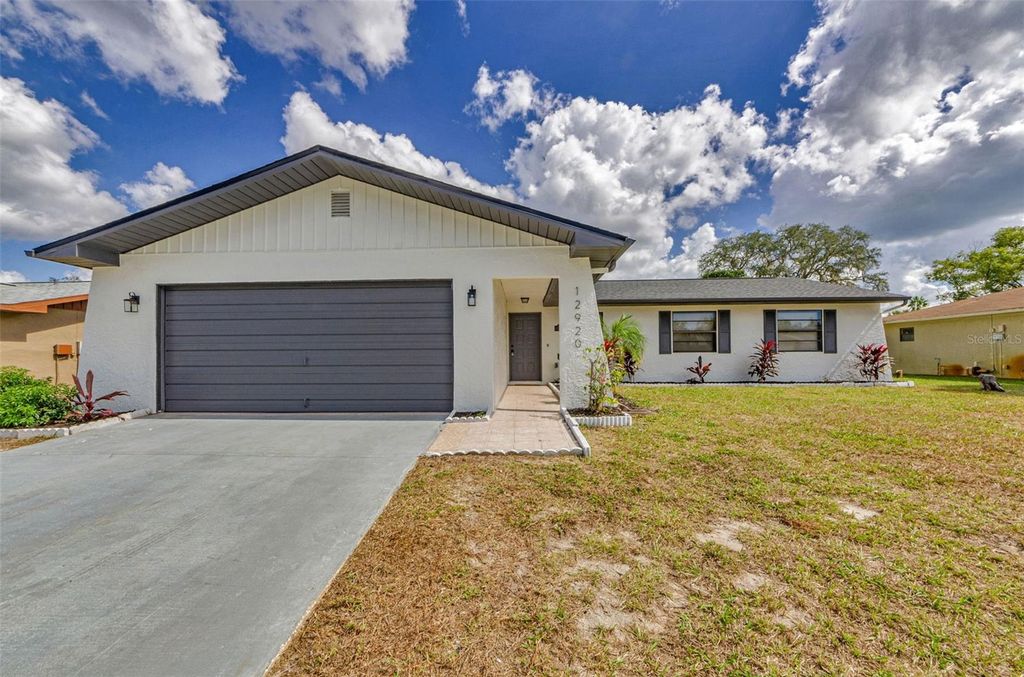 Photo of 12920 Walnut Tree Lane, Hudson, FL 34669 (MLS # TB8440796)