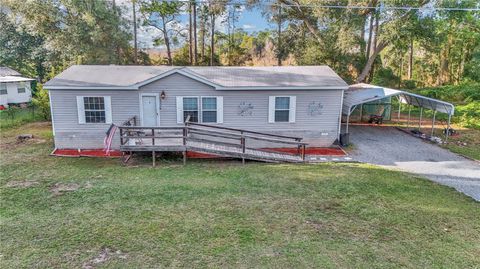 Photo of 5860 SE 183rd Terrace, Ocklawaha, FL 32179 (MLS # GC535159)