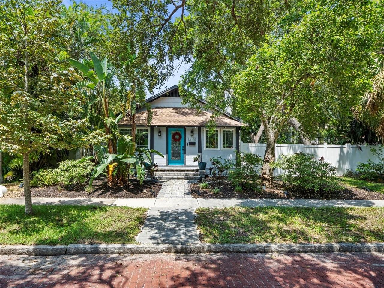 Luxury 3-Bedroom, 2-Bath Craftsman style home near Historic Old Northeast and Snell Isle in St. Petersburg is now available. Built in 1938, this timeless Old Florida home blends classic character with modern updates. Located on a charming brick-lined street surrounded by stately residences, the property is outside the flood zone, is a Non-evacuation zone and just steps from 4th Street’s trendy dining and shopping. It is also a short drive to downtown St Pete with it's new pier, fine dining and nightlife!
Step inside to a welcoming tiled foyer/flex room that's large enough for furniture, an office or perhaps a playroom? Make it your own! It also has a large "coat" closet and interesting circular cutout that is perfect for adding natural light to the spacious family room while maintaining some privacy. With original hardwood flooring, a timeless fireplace with mantle, and classic craftsman moldings throughout, you are instantly transported back to the elegance of the home’s 1938 origins. The updated kitchen features stone countertops, a farm sink with an old school window above, Thomasville soft-close cabinetry, and newer stainless steel GE appliances. This is all flowing seamlessly into the inside laundry/mudroom with backyard access. Once outdoors, enjoy a huge vinyl-fenced yard and an oversized side yard. There is a concrete patio for a grill or firepit, and a brand new deck for lounging and enjoying our Florida weather. Also, enjoy alley access and a large concrete parking pad for added convenience. Guest bedroom #1 is off the living area in the front of the home, and includes an additional "nook" ideal for a home office or nursery. The hall bathroom is shared with guest bedroom #2, has a bathtub and has been updated as well. The primary bedroom is roomy with a large closet and a lot of natural light. There is a beautifully appointed and updated ensuite bathroom with double sinks, a walk-in tiled shower, linen closet and direct outside access to the backyard and deck.
Historic Old Northeast and the surrounding area is one of St. Petersburg’s premier luxury destinations, appealing to the most discerning buyers seeking an elevated lifestyle. The vibrant St. Pete/Tampa Bay area offers an international airport and port, world-class professional sports teams including the Rays, Buccaneers, and Lightning, as well as renowned dining, shopping, arts, and entertainment—ranging from Broadway-style performances to boutique experiences. Centrally located near some of the nation’s top-rated beaches, this neighborhood provides the perfect blend of historic charm and modern luxury living.