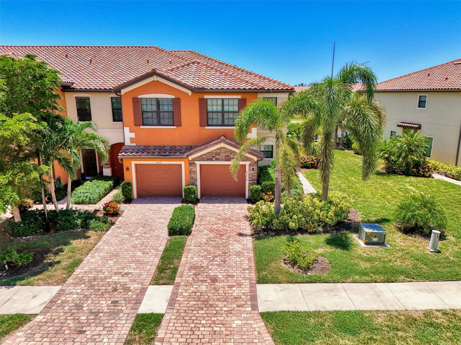 This two-story townhome in the gated community of Gran Paradiso is a great fit for families. With 3 bedrooms, 2.5 bathrooms, and upgraded lighting and ceiling fans throughout, it offers both comfort and function. The home is located on a quiet street with other young families and zoned for top-rated local schools. As an end unit, it shares only one wall and offers extra privacy. The large, extended screened-in patio features paver flooring, a relaxing hot tub, and peaceful views of water and greenery—an ideal spot for family time or winding down at the end of the day. Inside, you’ll find a well-designed layout with open living space on the main floor and all bedrooms upstairs. The attached garage provides extra storage and convenience. Gran Paradiso offers resort-style amenities the whole family can enjoy, including a large pool, tennis courts, a fitness center, playground, and year-round events and activities. This home combines quiet comfort with a strong sense of community—perfect for growing families. Contact us today to learn more or schedule a visit.